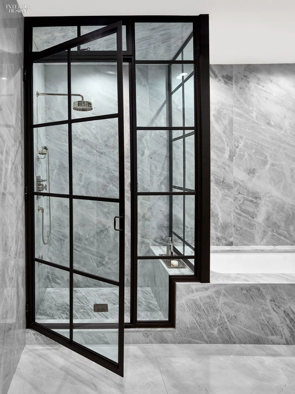 Steel shower door, marble slab bathro