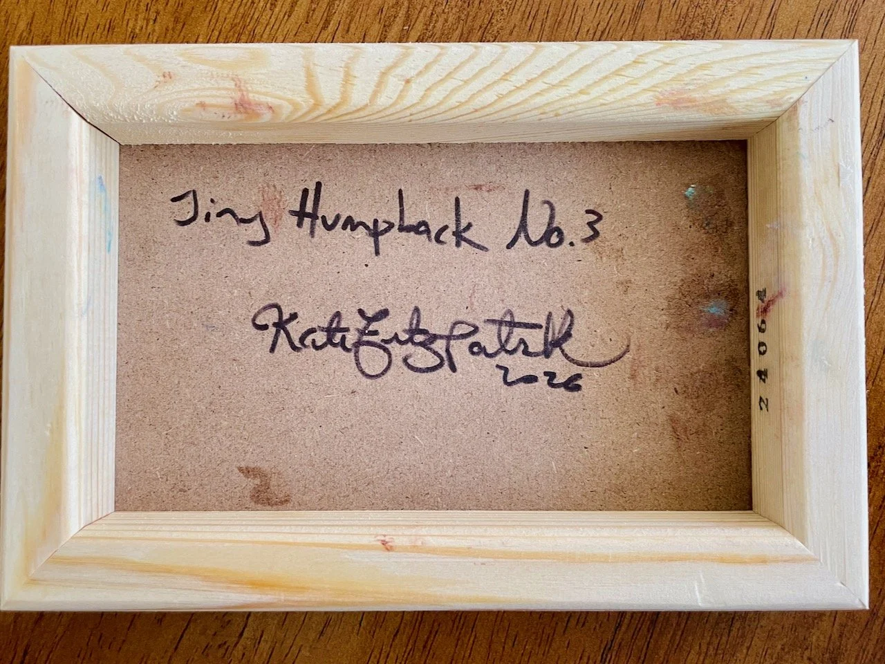 back of the cradled wood reads Tiny Humpback no. 3 kate fitzpatrick 2026