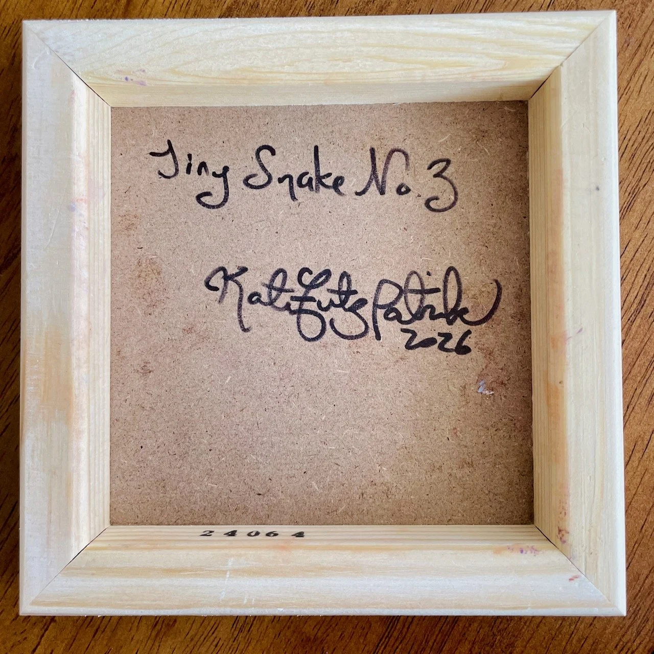 back of the cradled wood reads Tiny Snake no. 3 kate fitzpatrick 2026