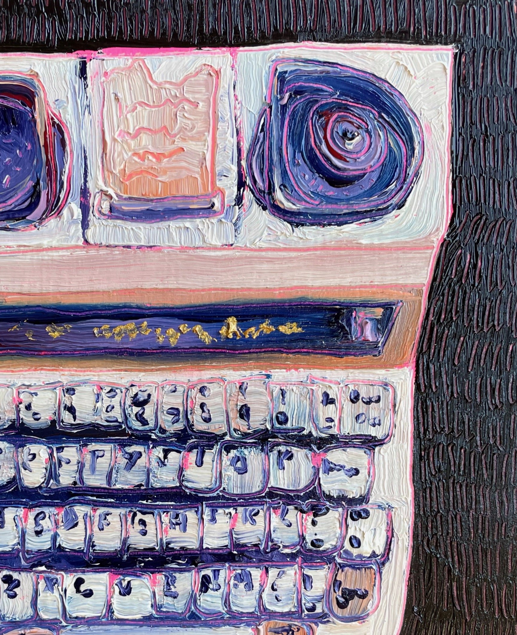 a close up on the purple and black tty showing paint texture and carving