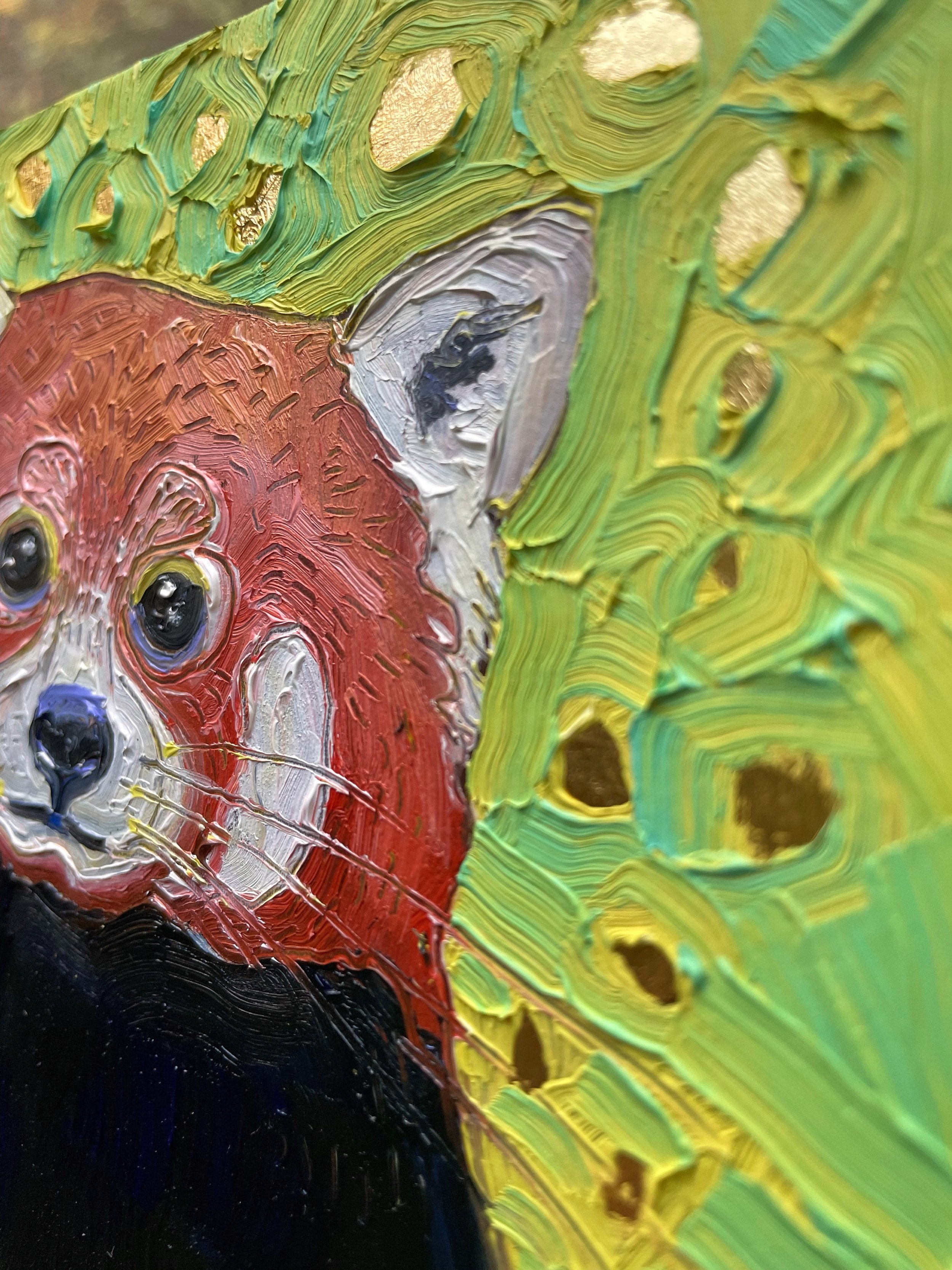a close up on the red panda painting showing thick paint texture