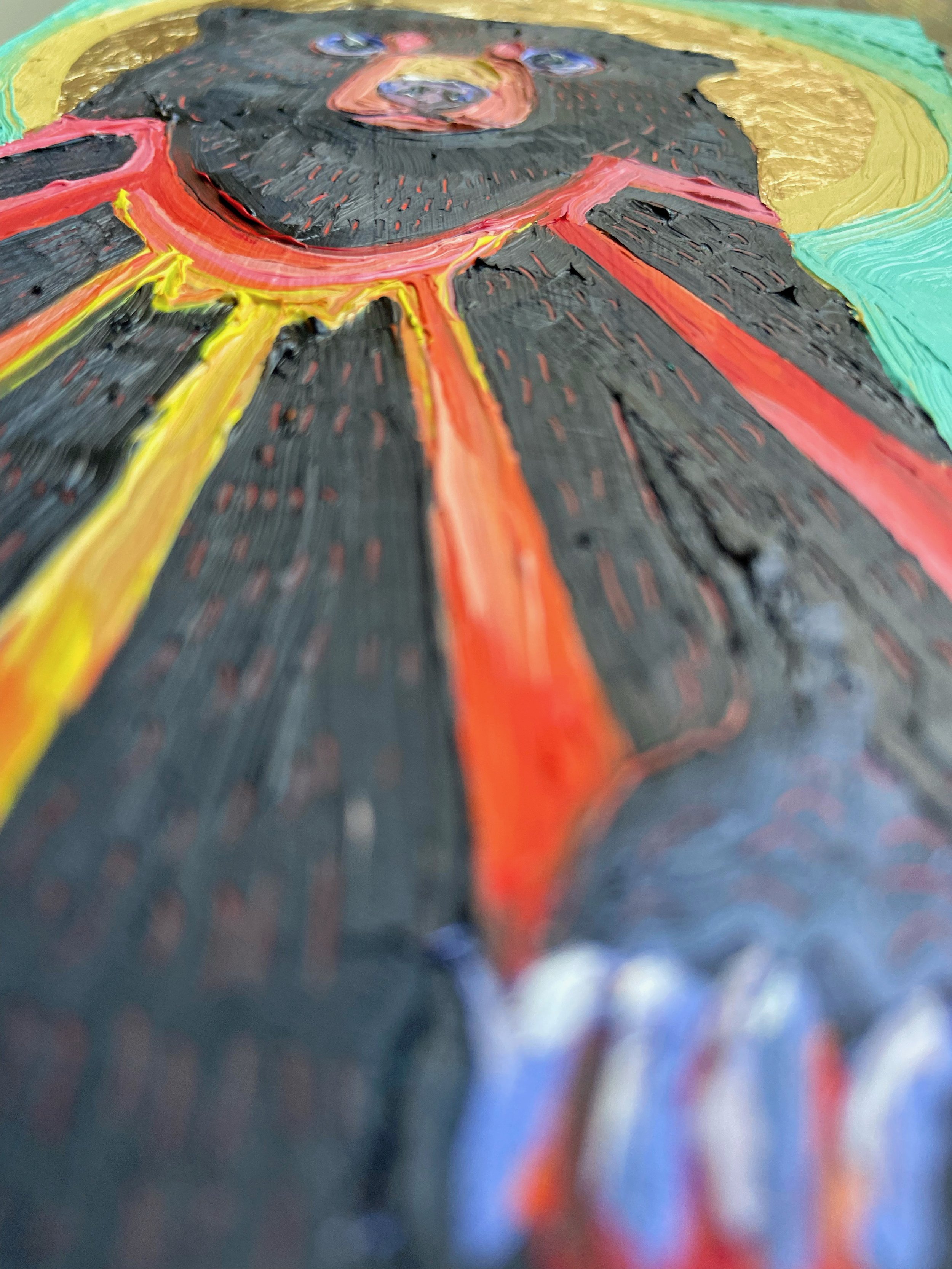 a low angle on the sunbear painting showing paint texture