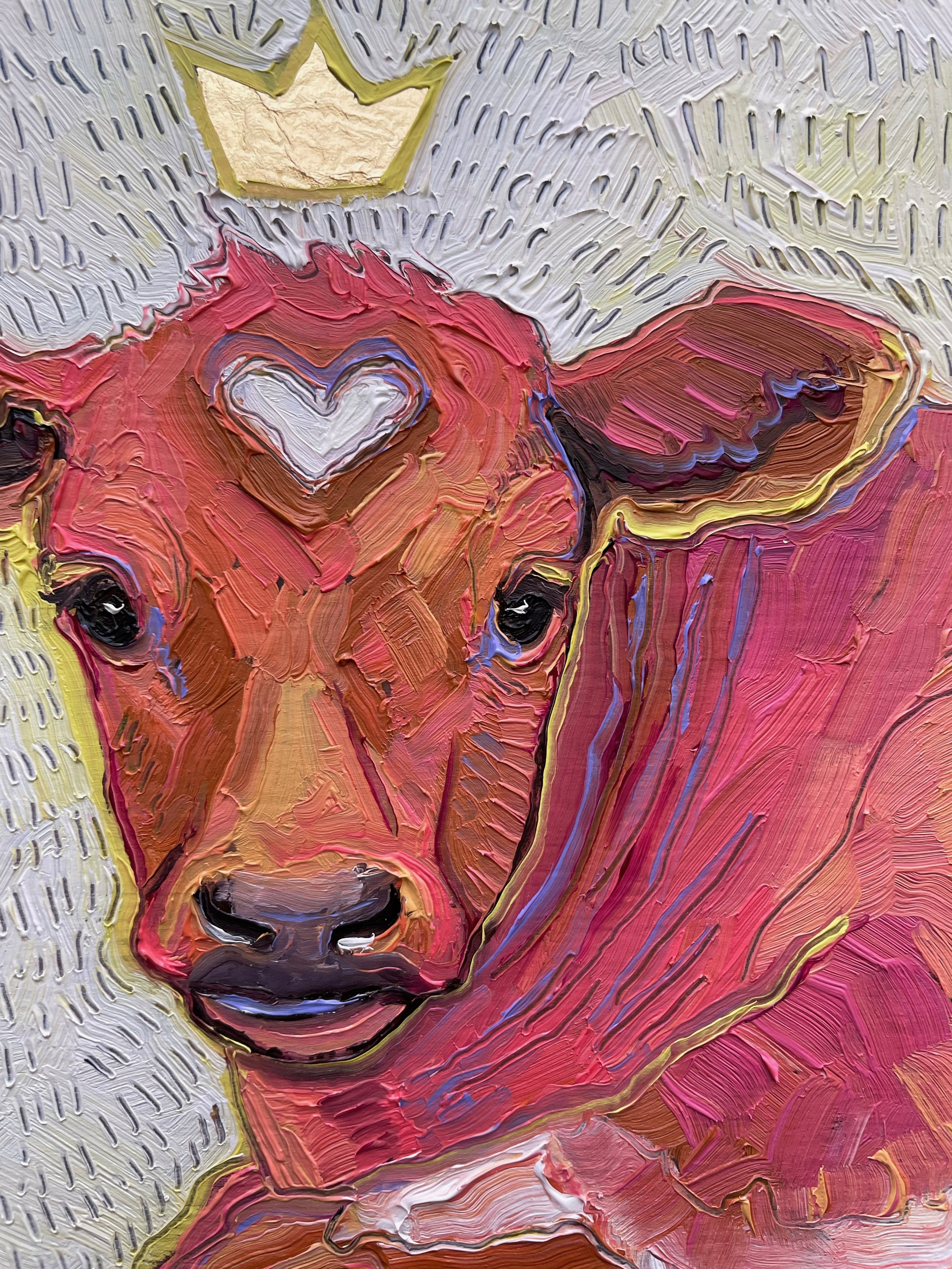 a close up on the cute baby cow painting. a white spot on its forehead forms a heart