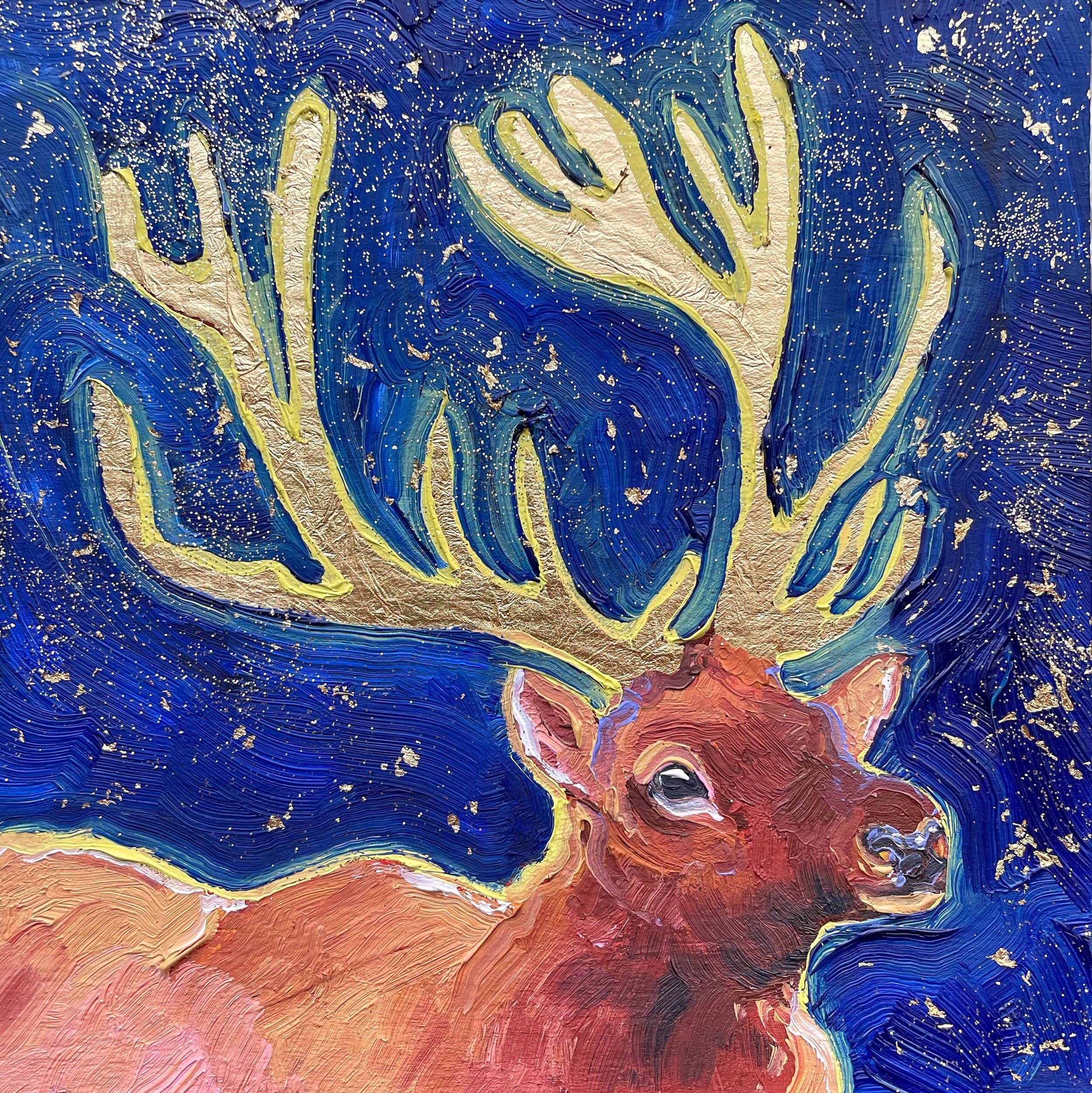 a painting of an elk with gold leaf antlers. the sky behind it is deep blue with gold glitter