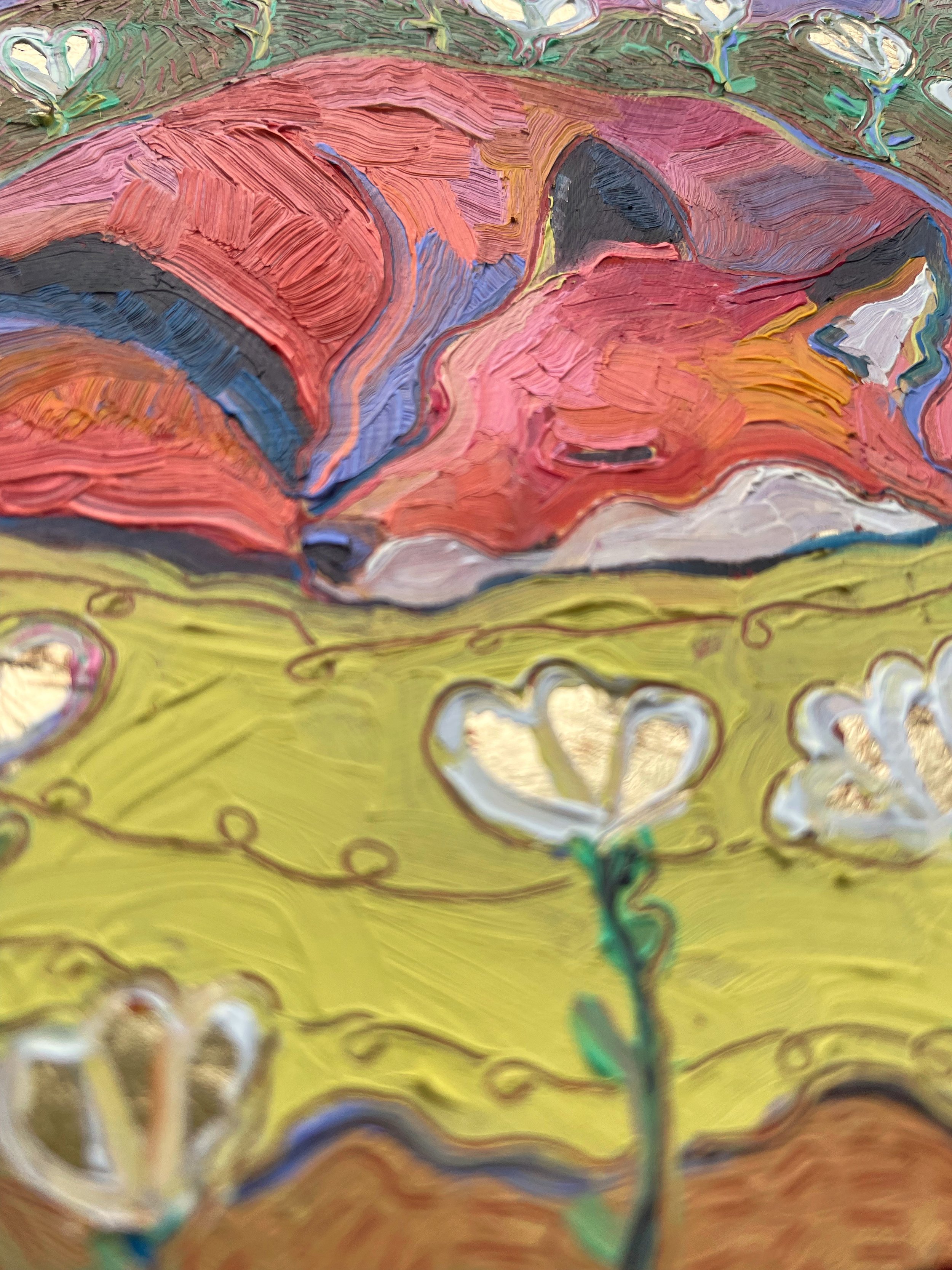 a low angle on the fox sleeping painting that shows light reflecting on the gold leaf flowers