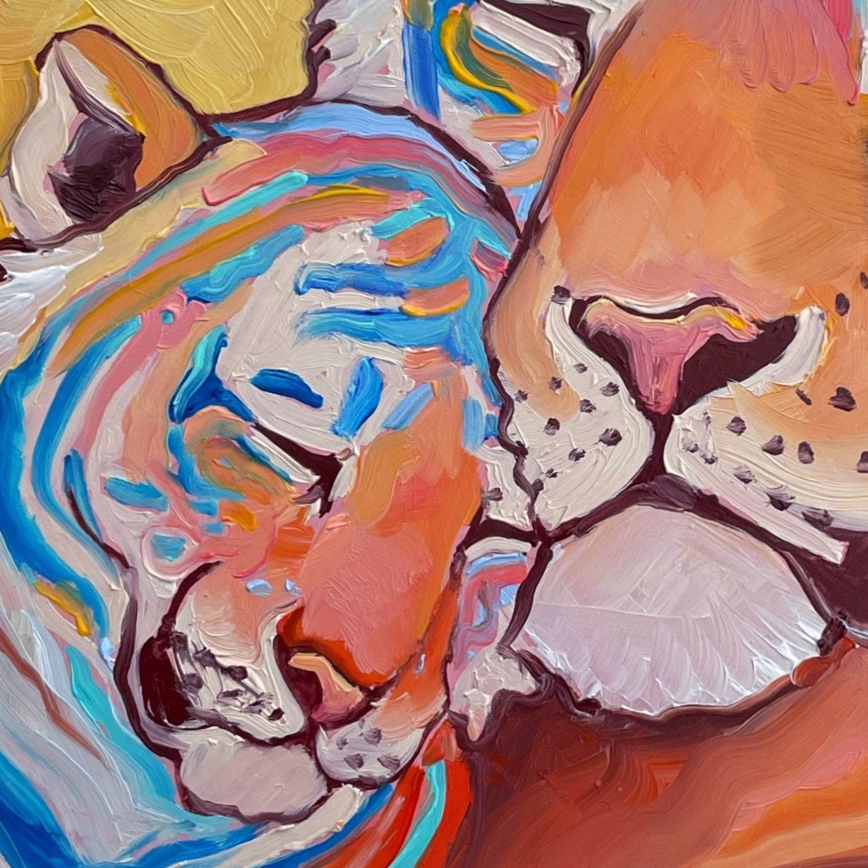 a colorful painting of a tiger cub nuzzling its parent.