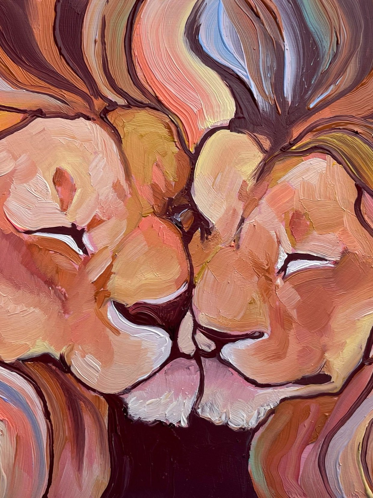 two lions nuzzling. their manes are colorful and entwined.