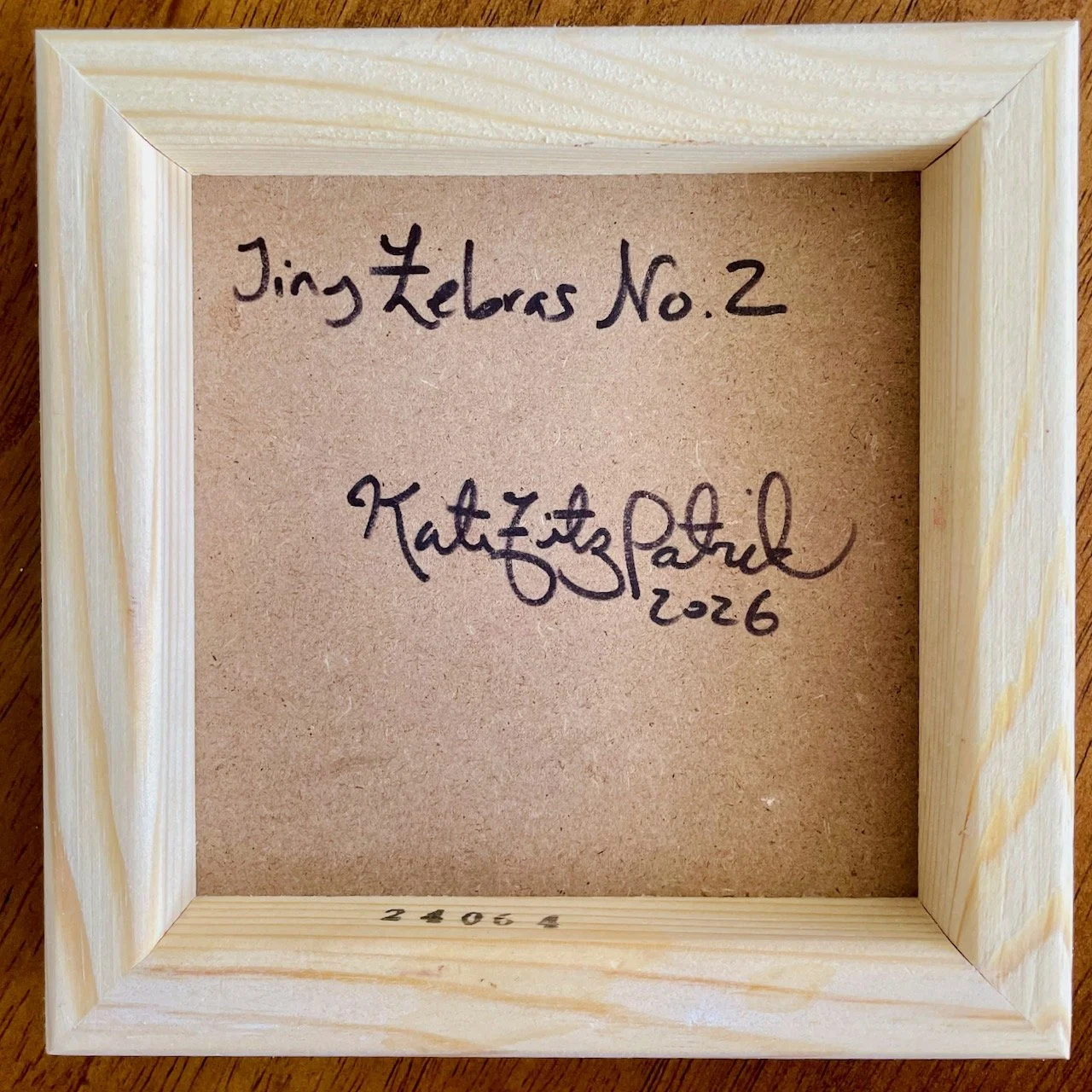 back of the cradled wood canvas with writing that reads Tiny Zebras No.2 Kate Fitzpatrick 2026