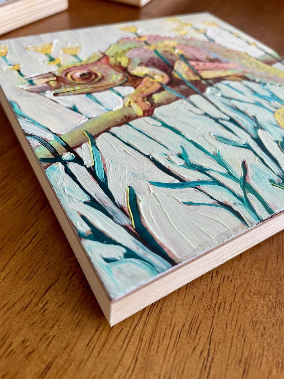 a low side angle of the chameleon painting