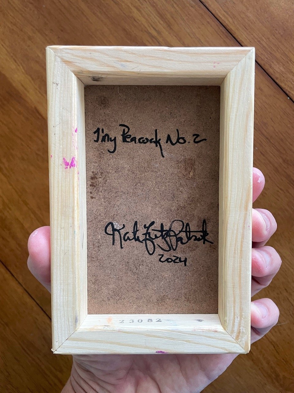 back of canvas with handwriting that reads tiny peacock no.2 kate fitzpatrick