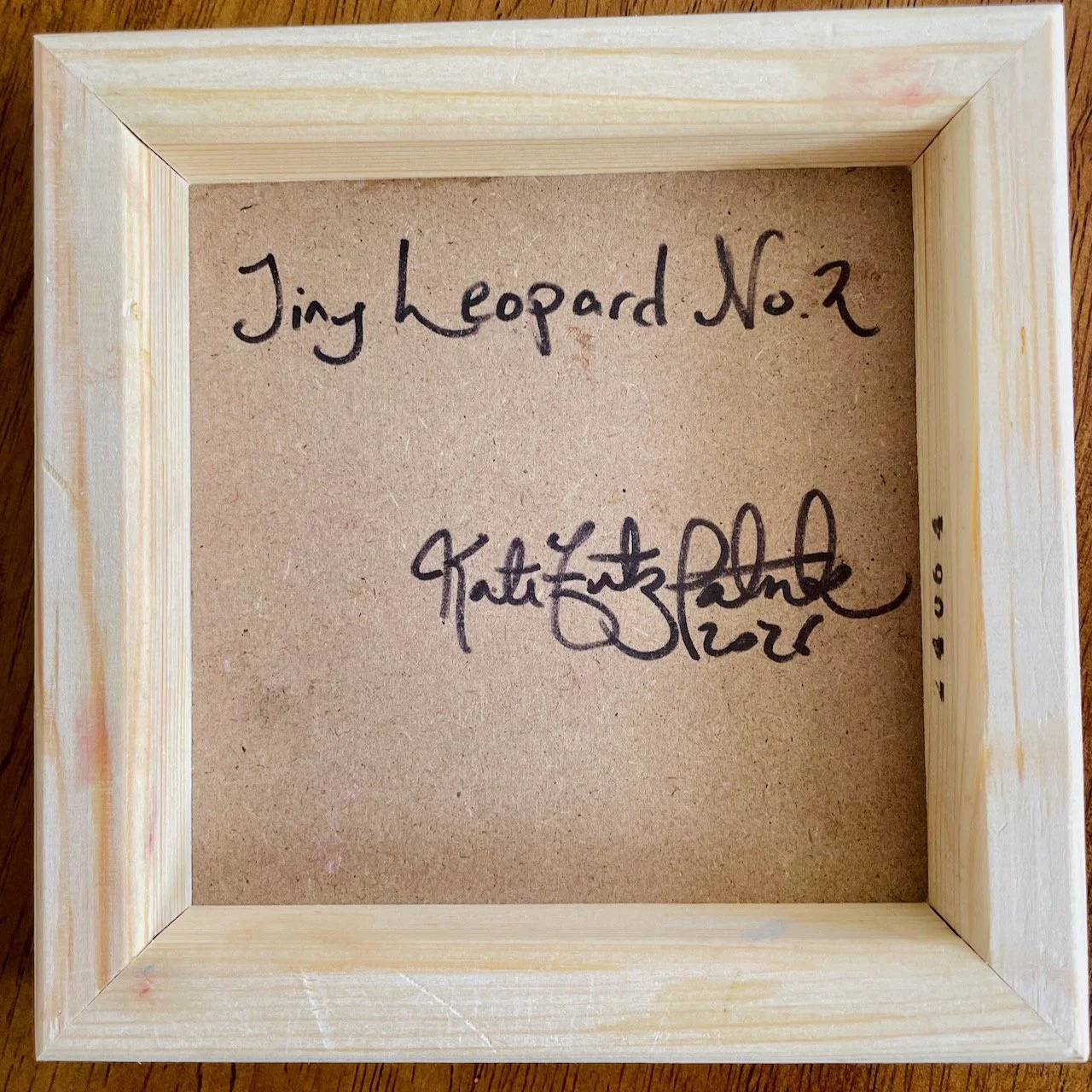 back of canvas with handwriting that reads tiny leopard no.2 kate fitzpatrick