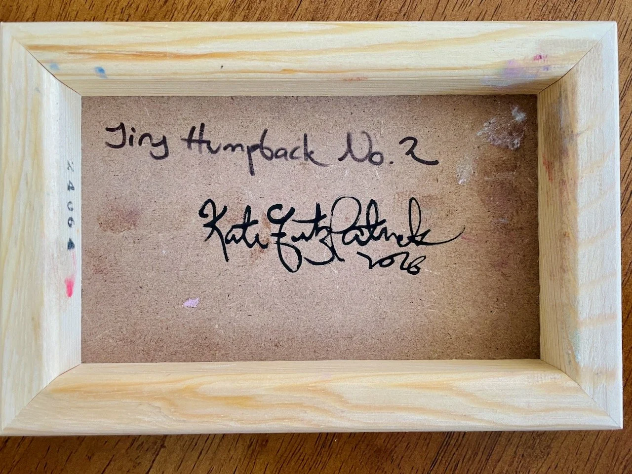 back of the cradled wood reads Tiny Humpback no. 2 kate fitzpatrick 2026