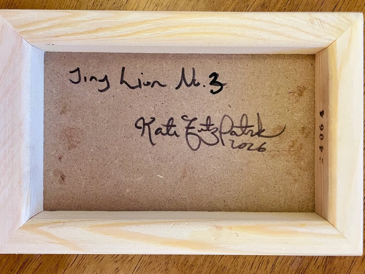 back of the cradled wood reads Tiny Lion no. 3 kate fitzpatrick 2026