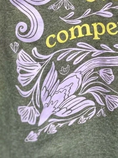 a close up of the back of the shirt showing the hidden ILY handshape
