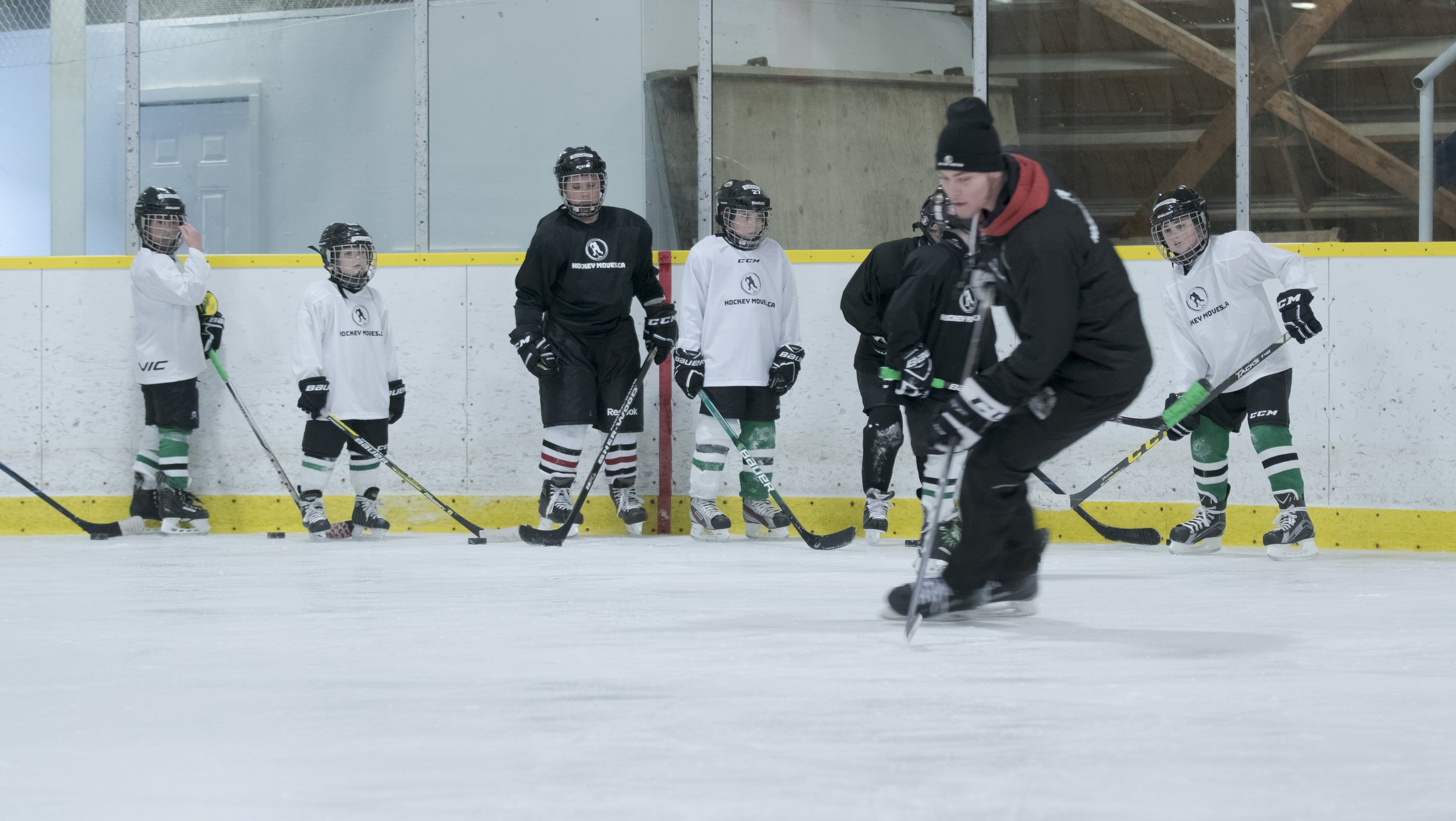  Coach Jason demonstrating a drill for Hockey Moves campers, 2019 