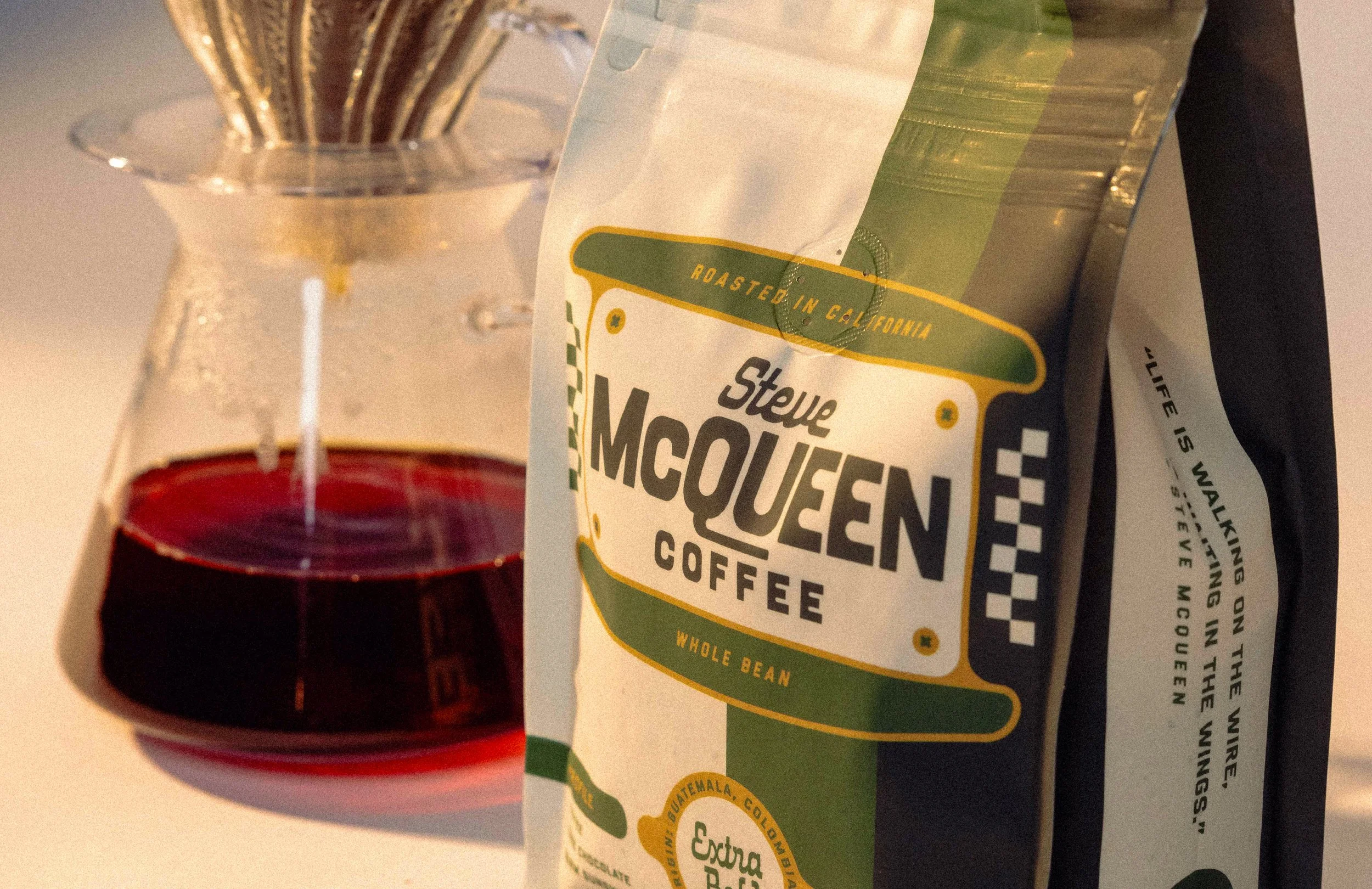 Vintage motorcycle-inspired badge design on Steve McQueen Coffee pouch packaging