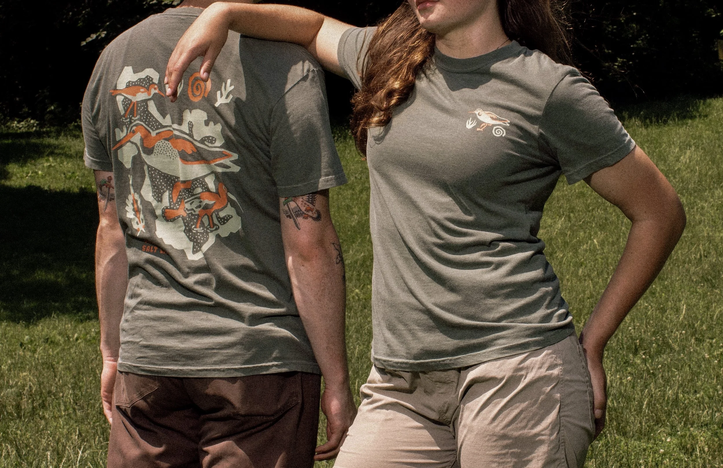 Conservation apparel design featuring Wilson's Phalarope on t-shirt modeled outdoors