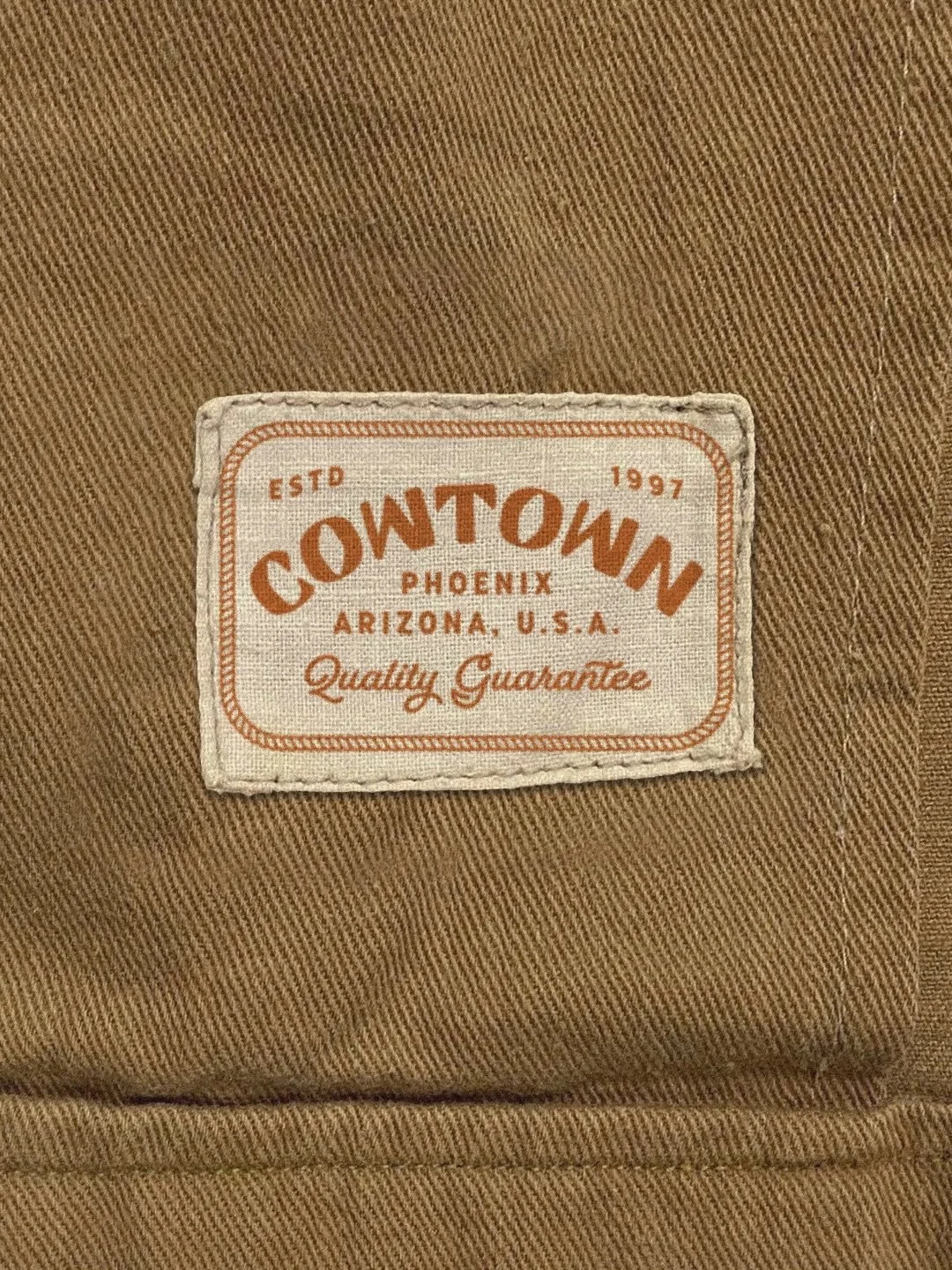 A couple of clothing labels from the archive for Cowtown.