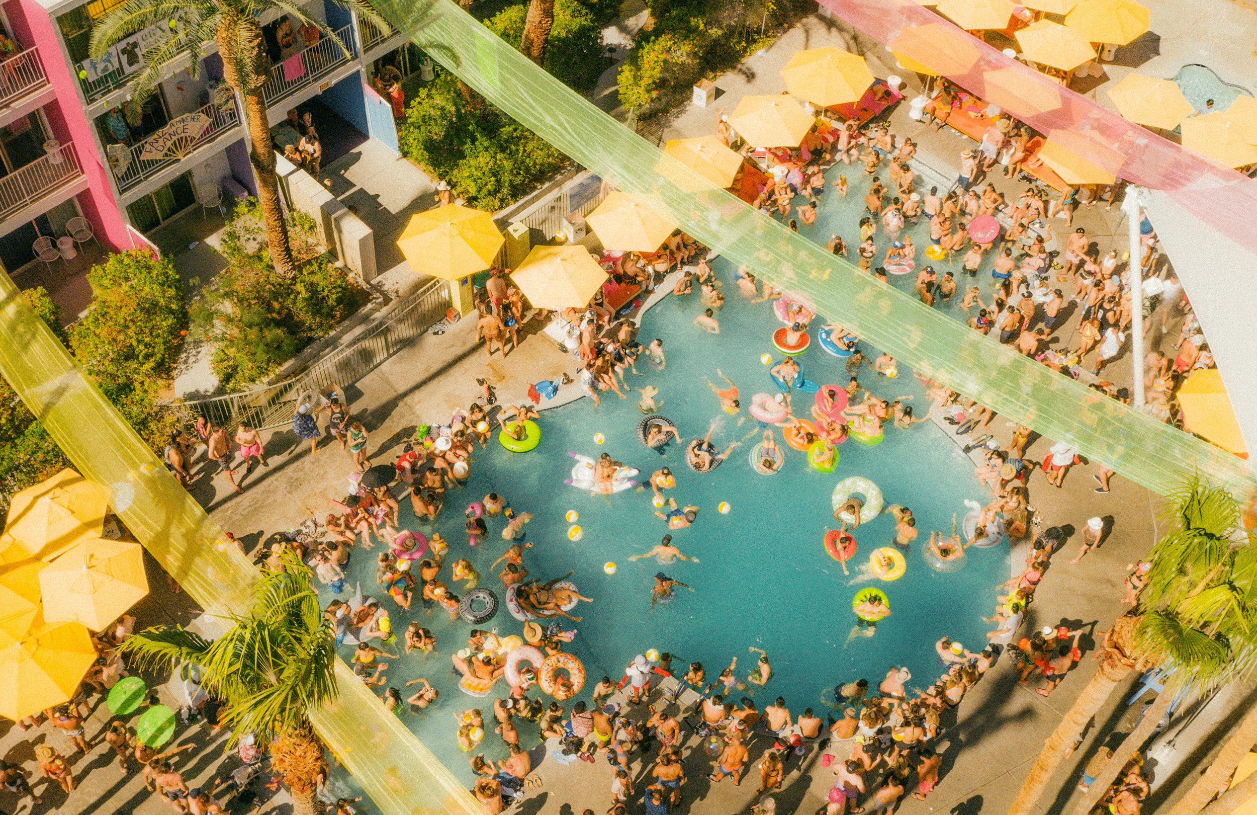 Splash House merch collection, overhead pool view of event.