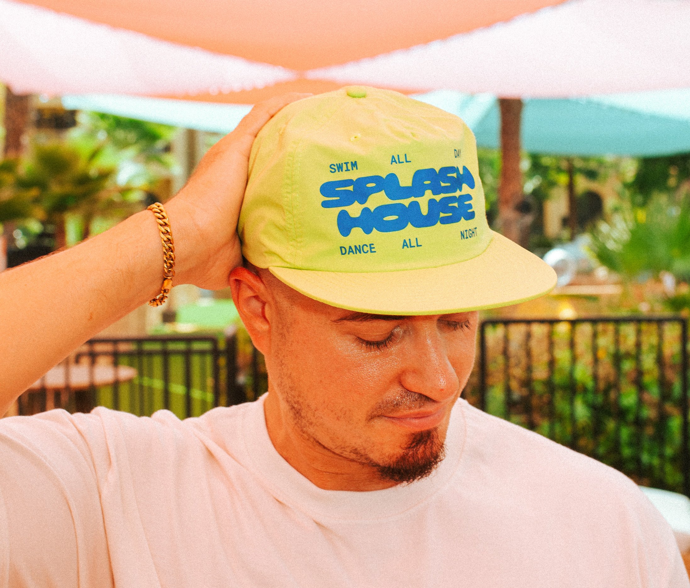 Neon swim cap with bold bubble Splash House logo text for Splash House merch collection.