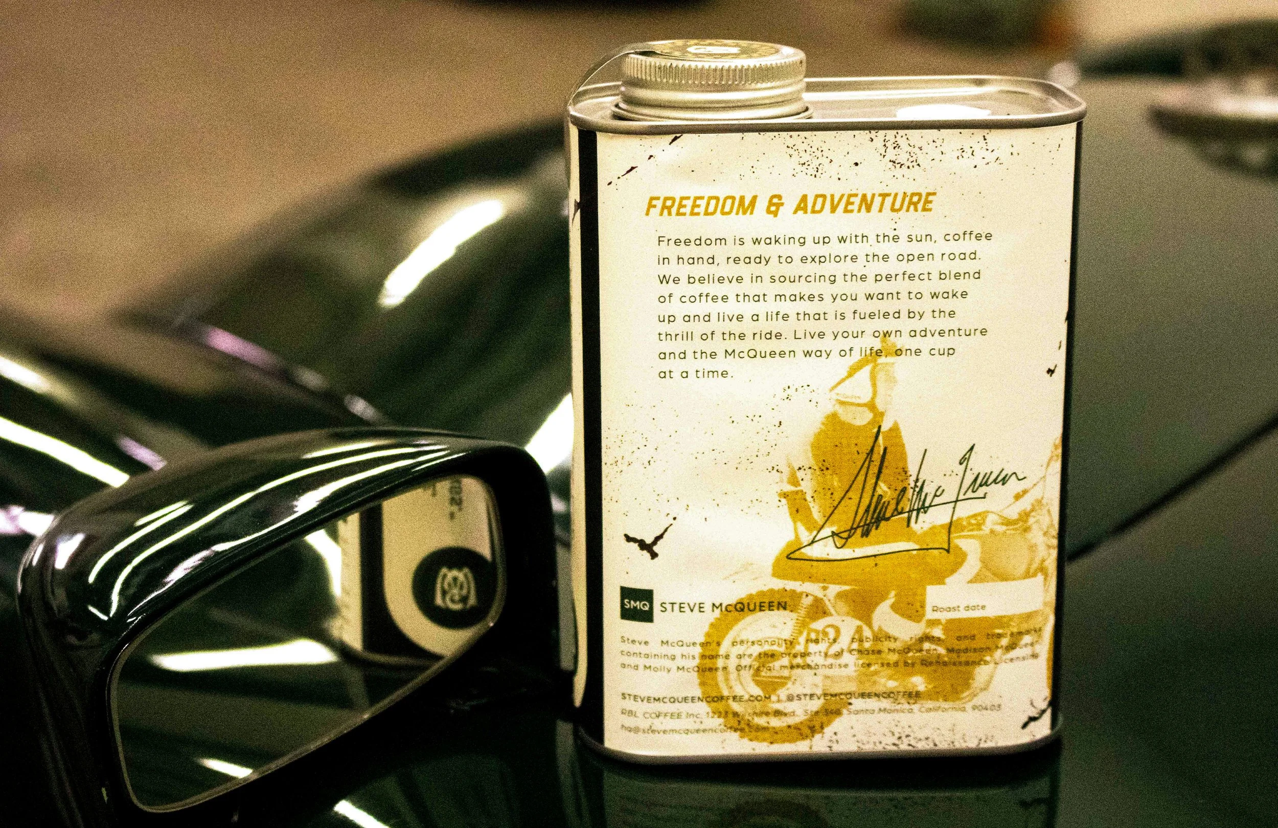 Steve McQueen Coffee tin back panel showing brand story text on vintage car hood