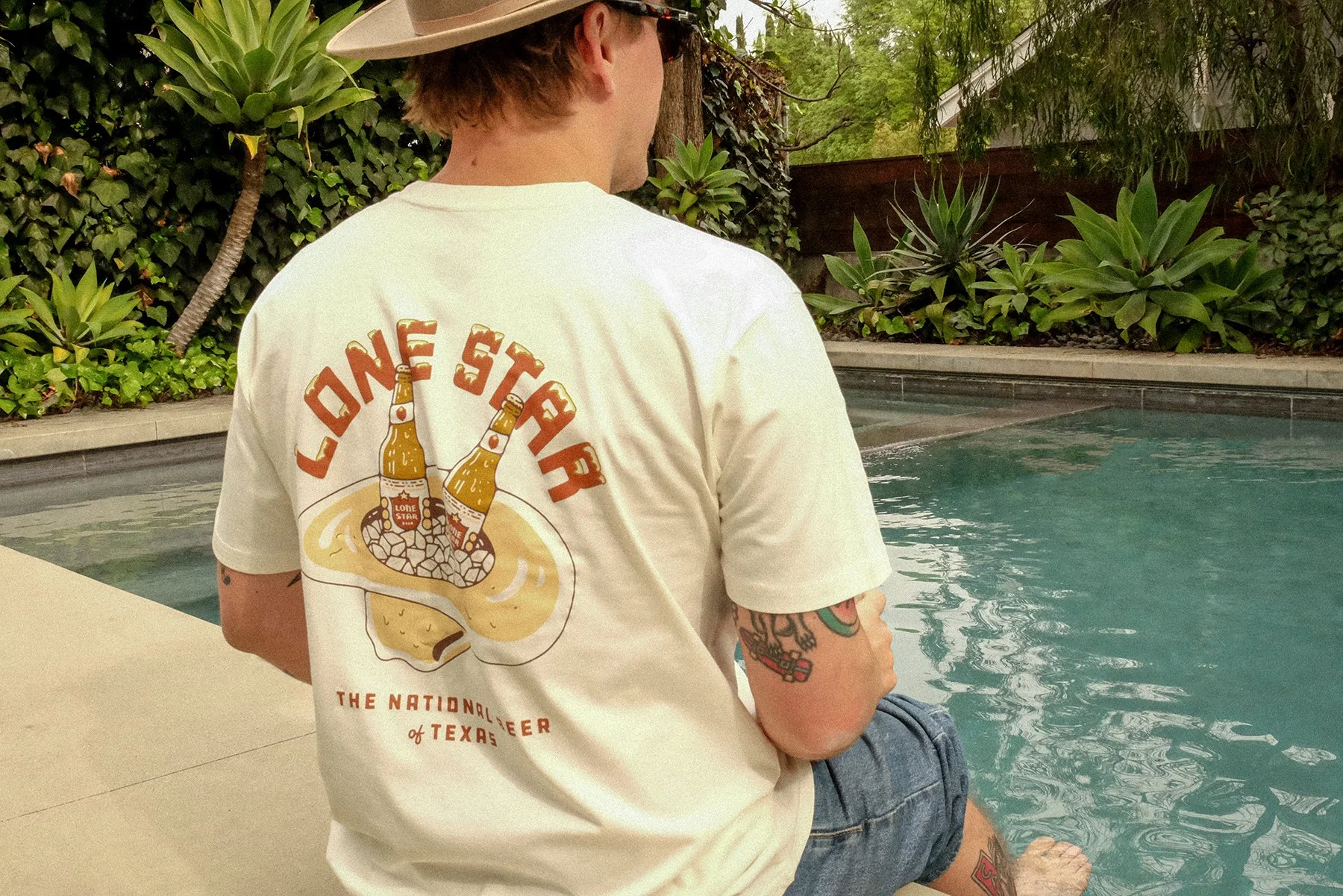 Lone Star Beer summer collection cowboy hat cooler back shirt design detail sitting by pool