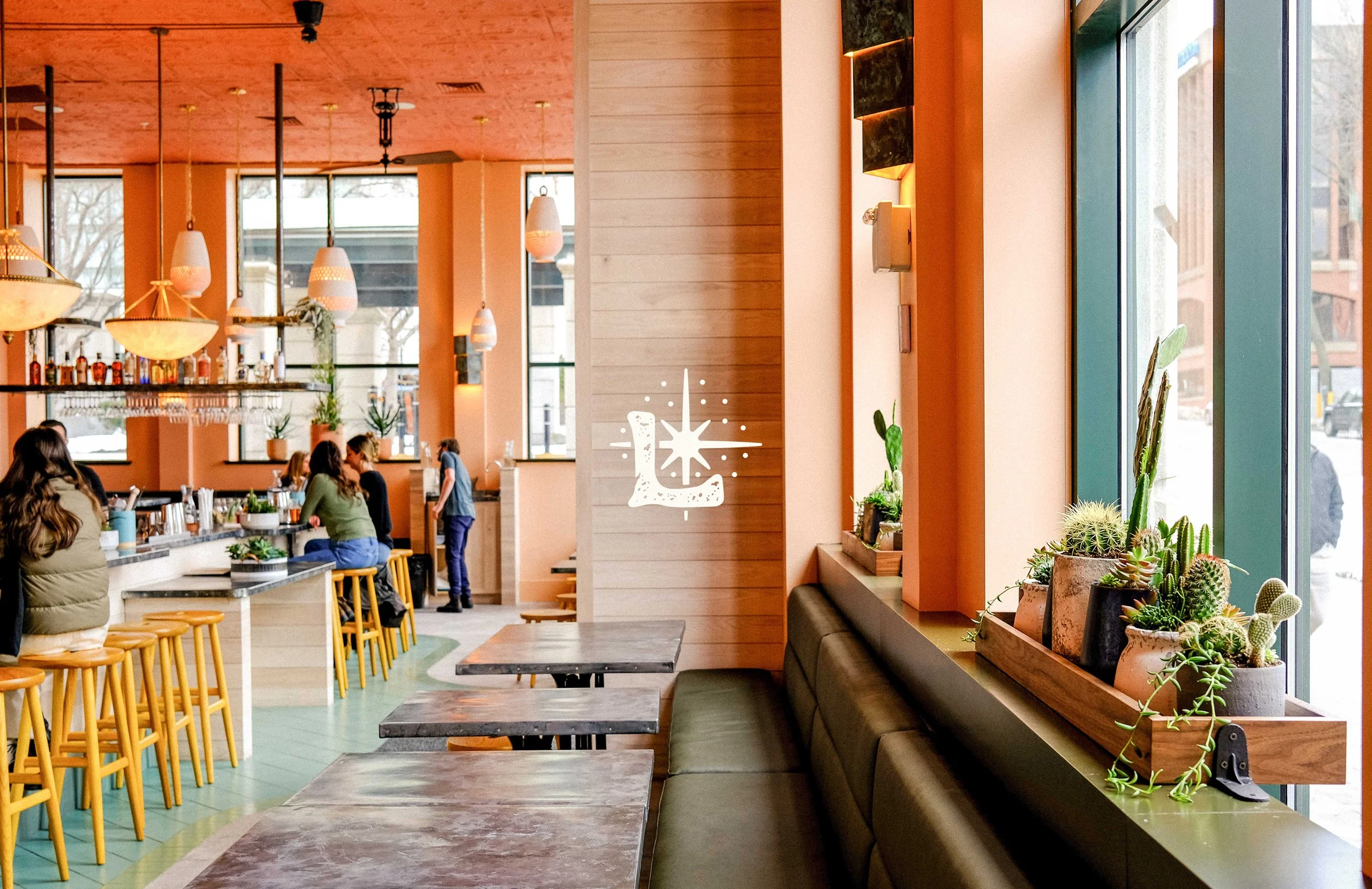 Interior of Lenora Restaurant featuring a branded L monogram design