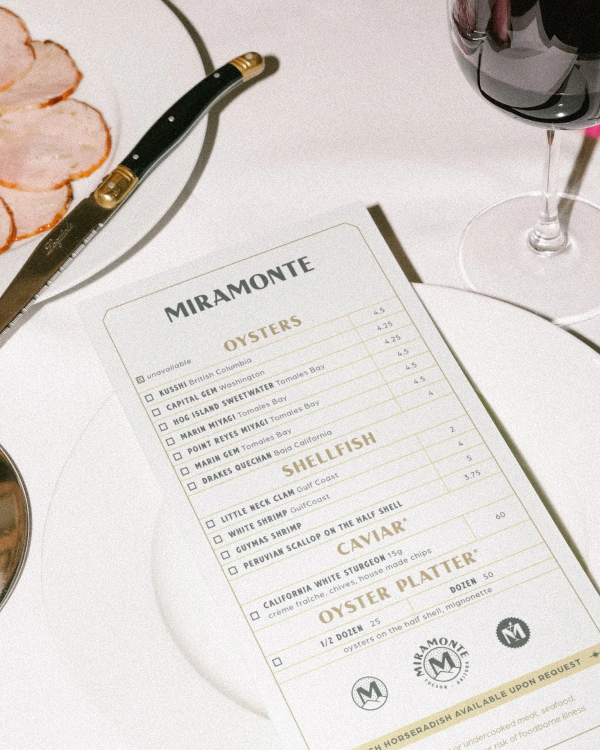 Raw seafood bar menu design layout featuring oysters and caviar for Miramonte restaurant