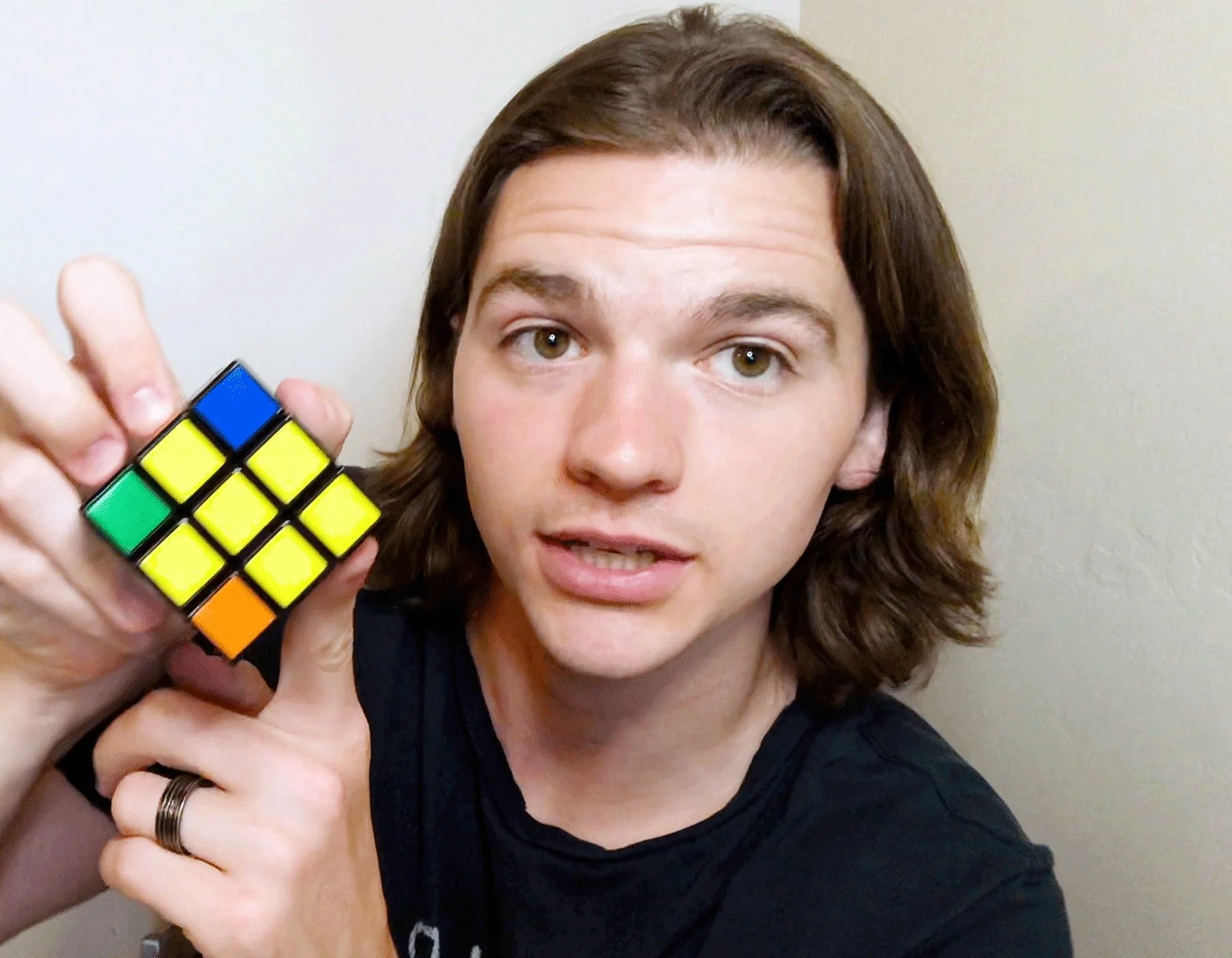 Joel Courtney Solves A Rubik's Cube In Just Six Steps