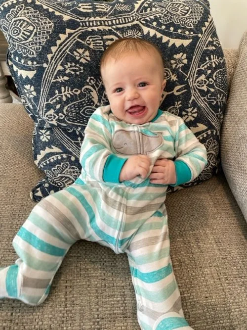 2.5 month old only sleeping while being held now going into his crib