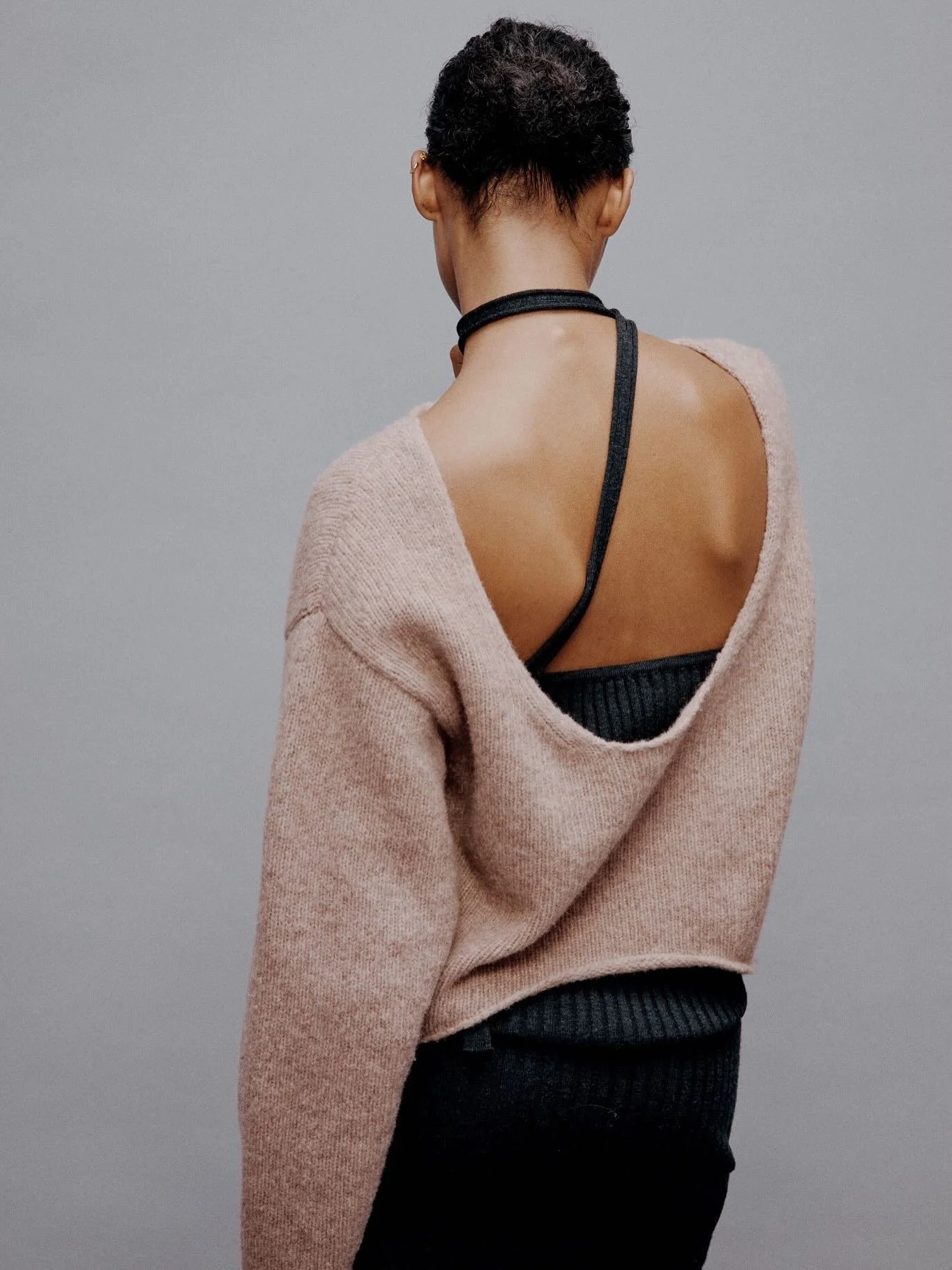 The reversible round pullover. Styled frontwards or backwards and layered.