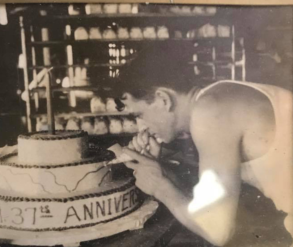 Former owner and late Louis Kelly at work the Yum Yum Shop