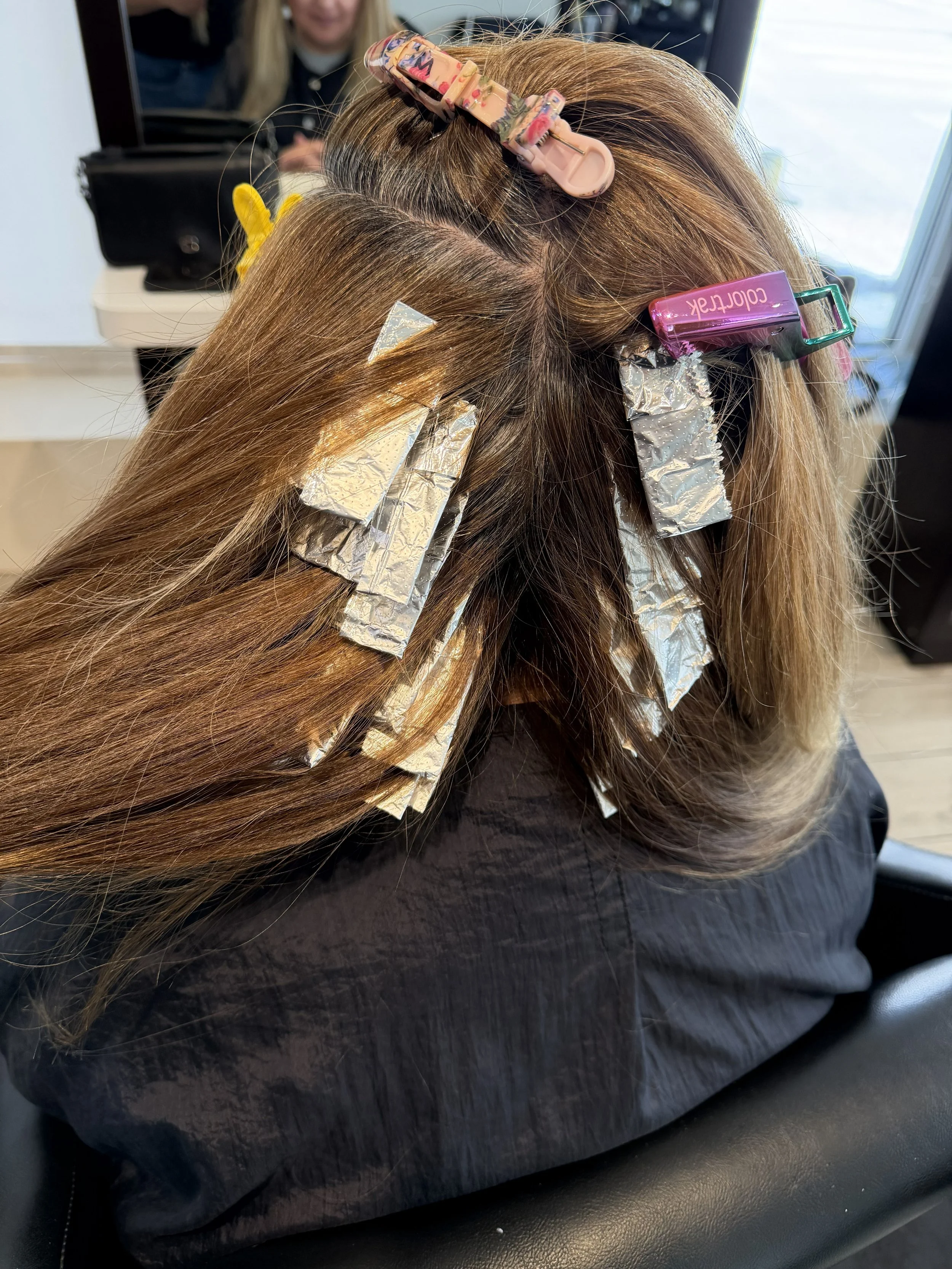 Professional hair color application at Salon Sonik in Pasadena