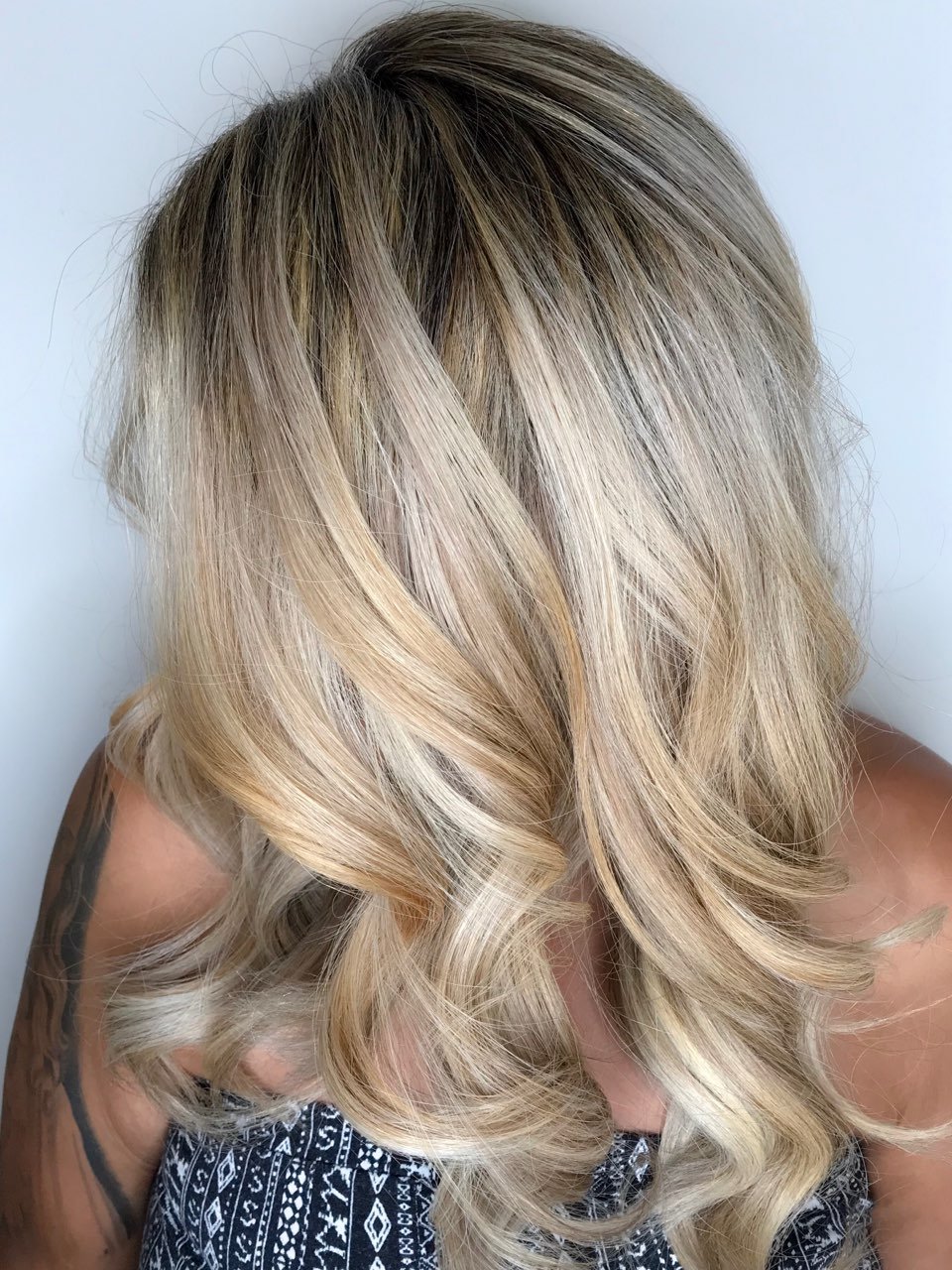 Blonde highlights with dimensional color at Salon Sonik hair salon in Pasadena