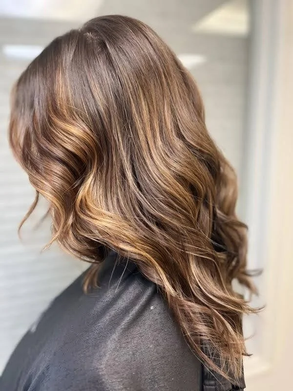 Dimensional hair color correction result with blended tones at Salon Sonik