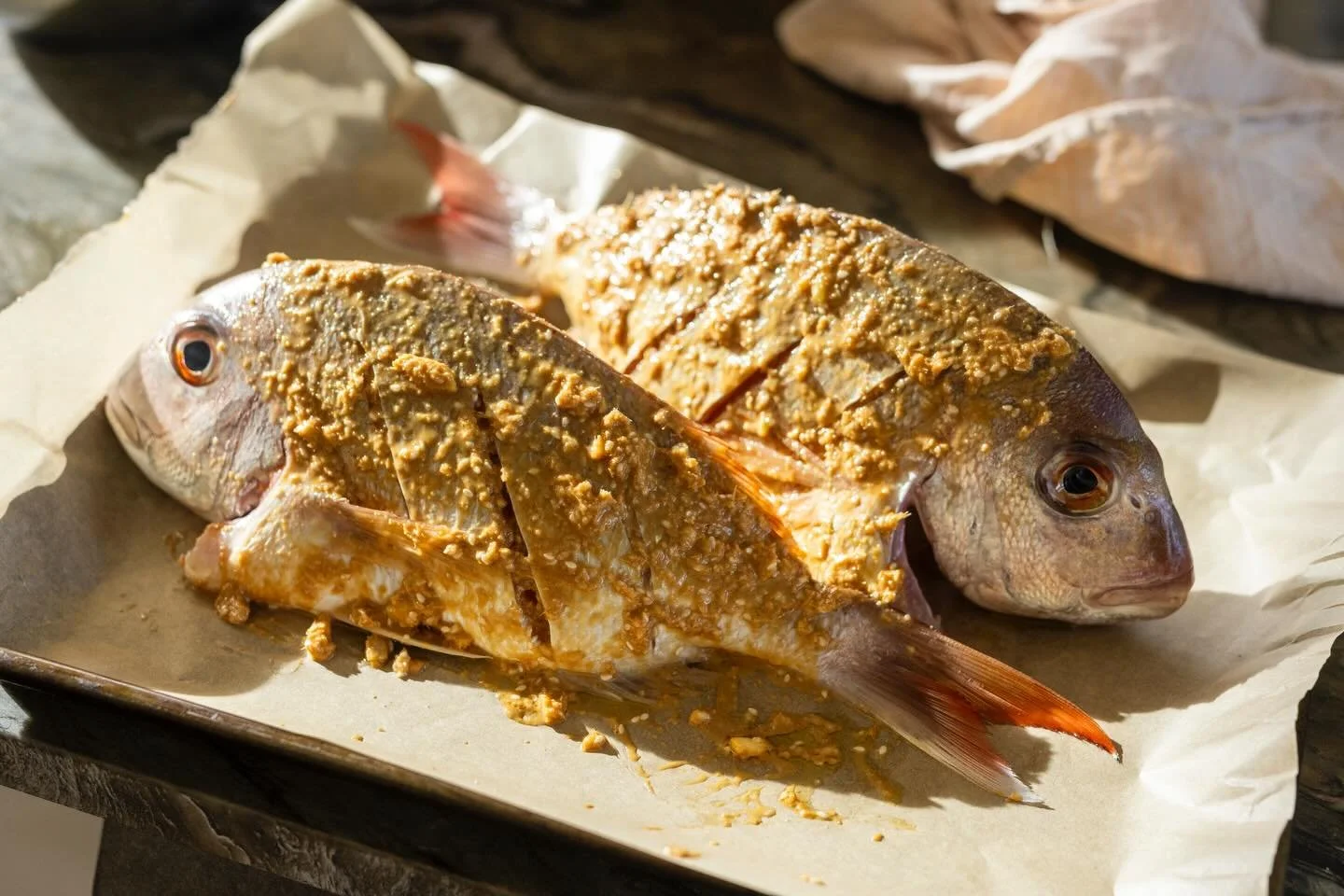 Baked snapper with ginger, garlic, sesame, peanuts and coriander. 

Link in bio for recipe 🐟
