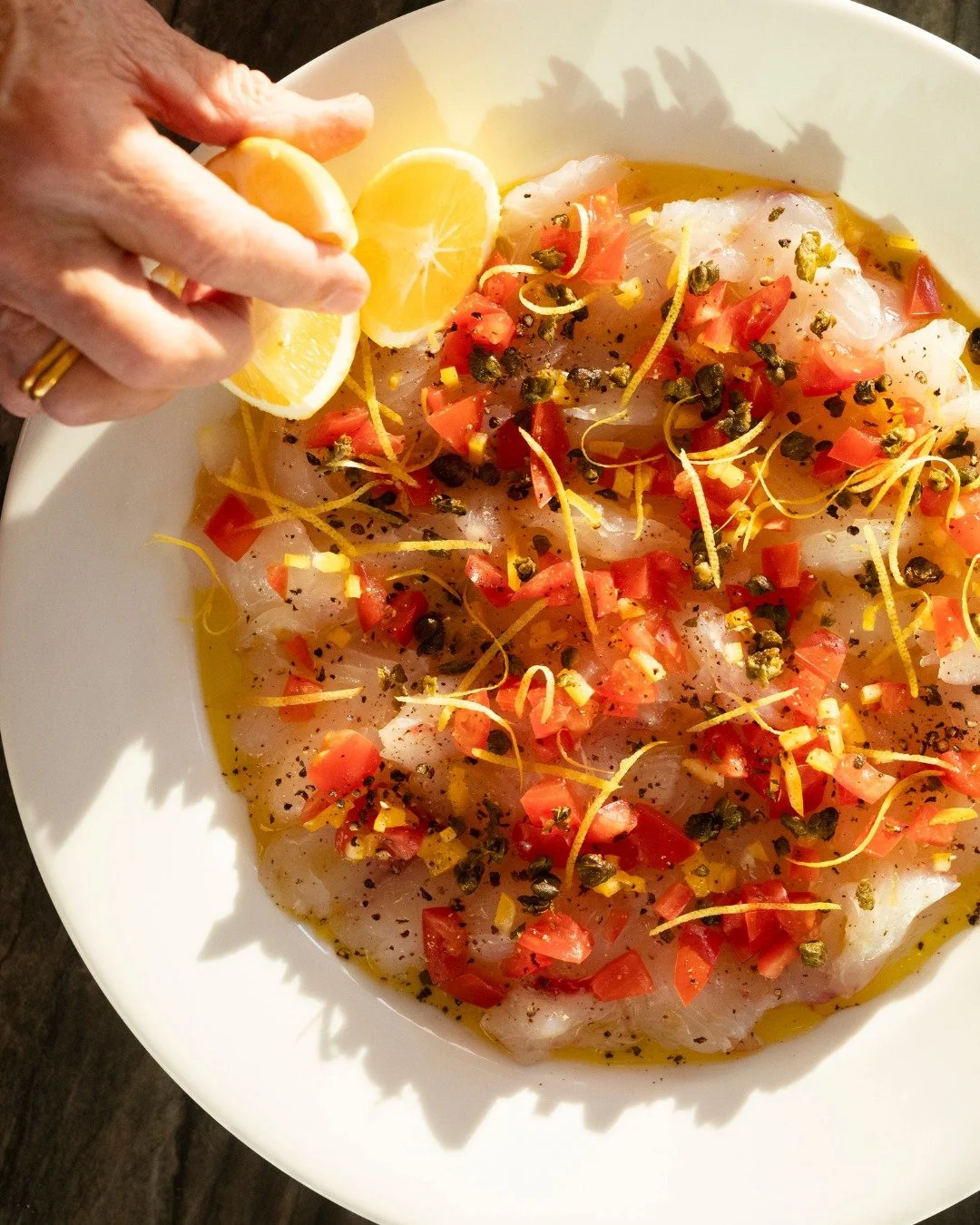 Snapper crudo with fried capers, tomato, and lemon zest. A delicious recipe you can use for many types of fresh white fish.

Up now for members on raymcvinnie.com, link in bio for recipe 🐟