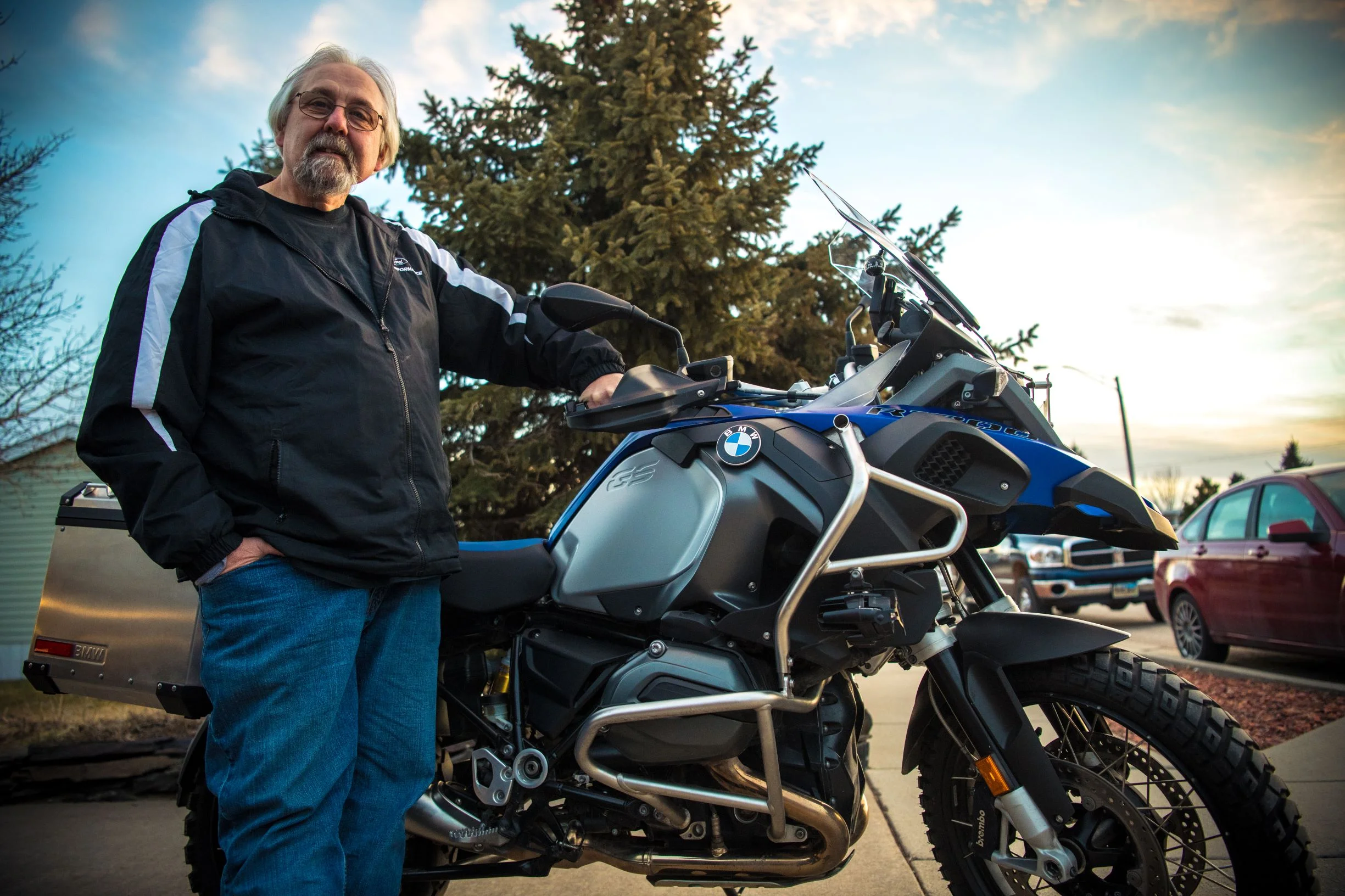 Forest, Pat’s stepson, making him pose outside next to his bike on a beautiful, South Dakota December afternoon.