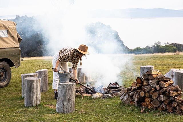 Tossing some coals on my salt baked flounder on @satelliteisland , recipe via the link in my profile #sarahglovertravels #outdooradventures #outdoorkitchen pic @nick_jaffe