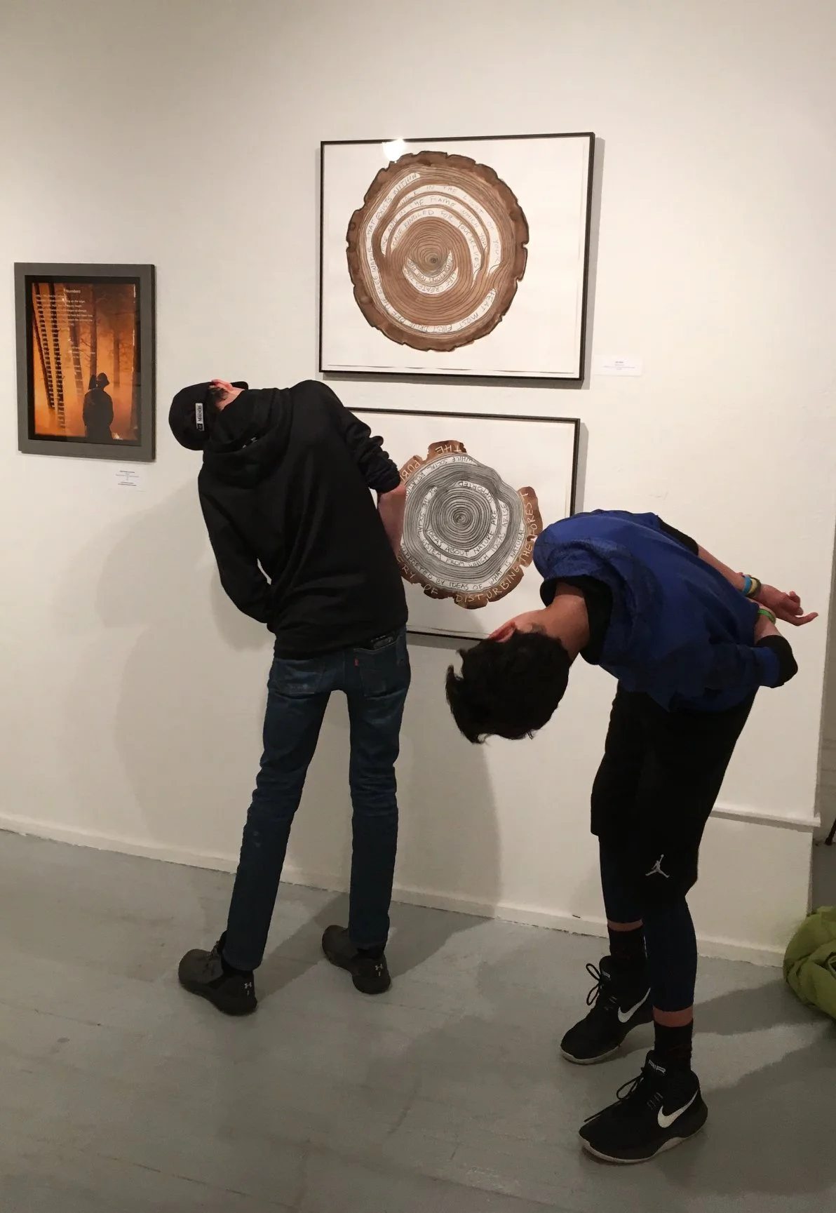 Viewers responding to the exhibition Conversations Through the Smoke, Fire Science Network 2018 (various venues)