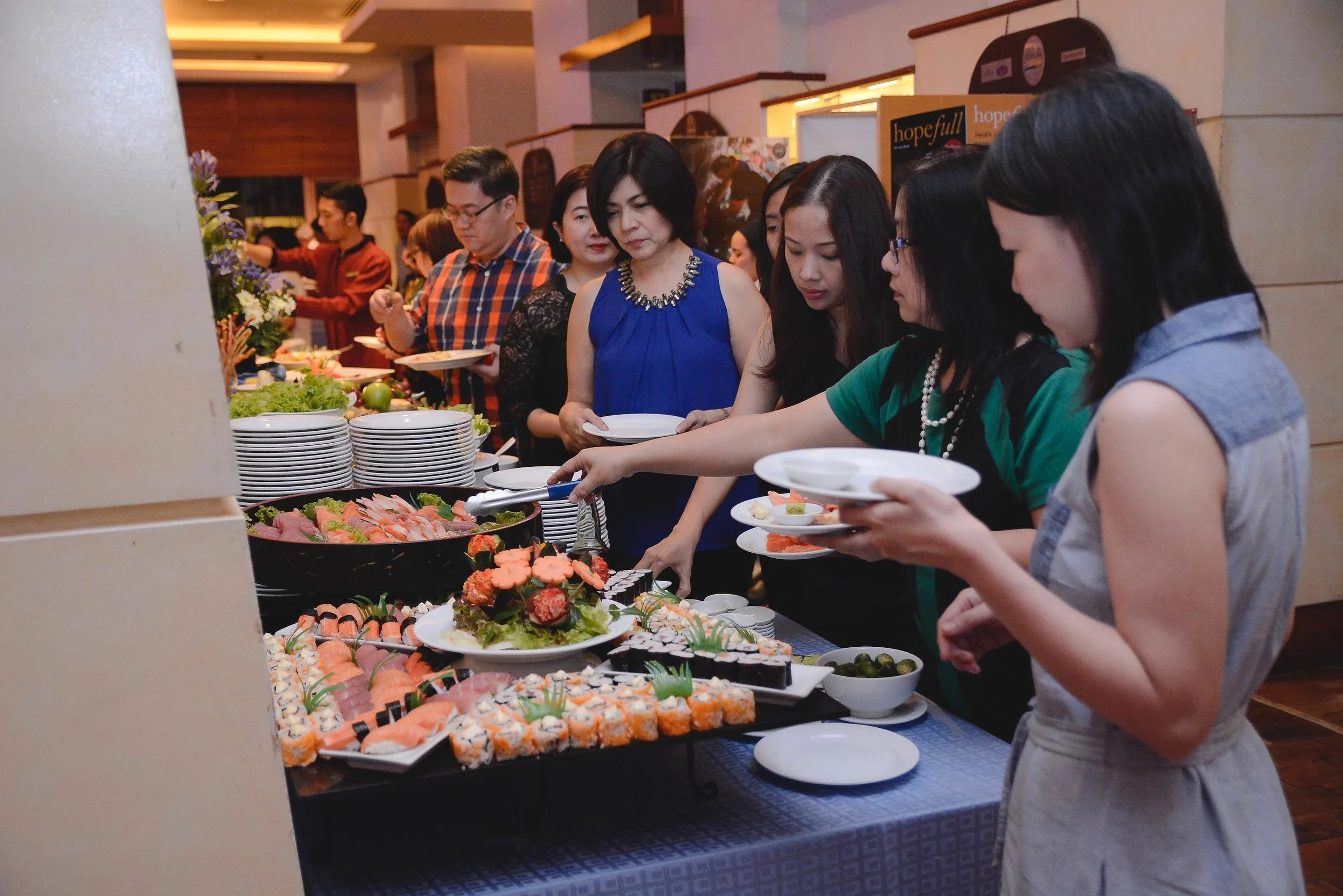 enjoying a sumptuous Japanese-themed dinner spread