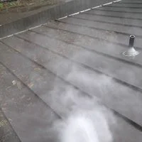 Metal roof cleaning using low-pressure techniques and safe treatments.