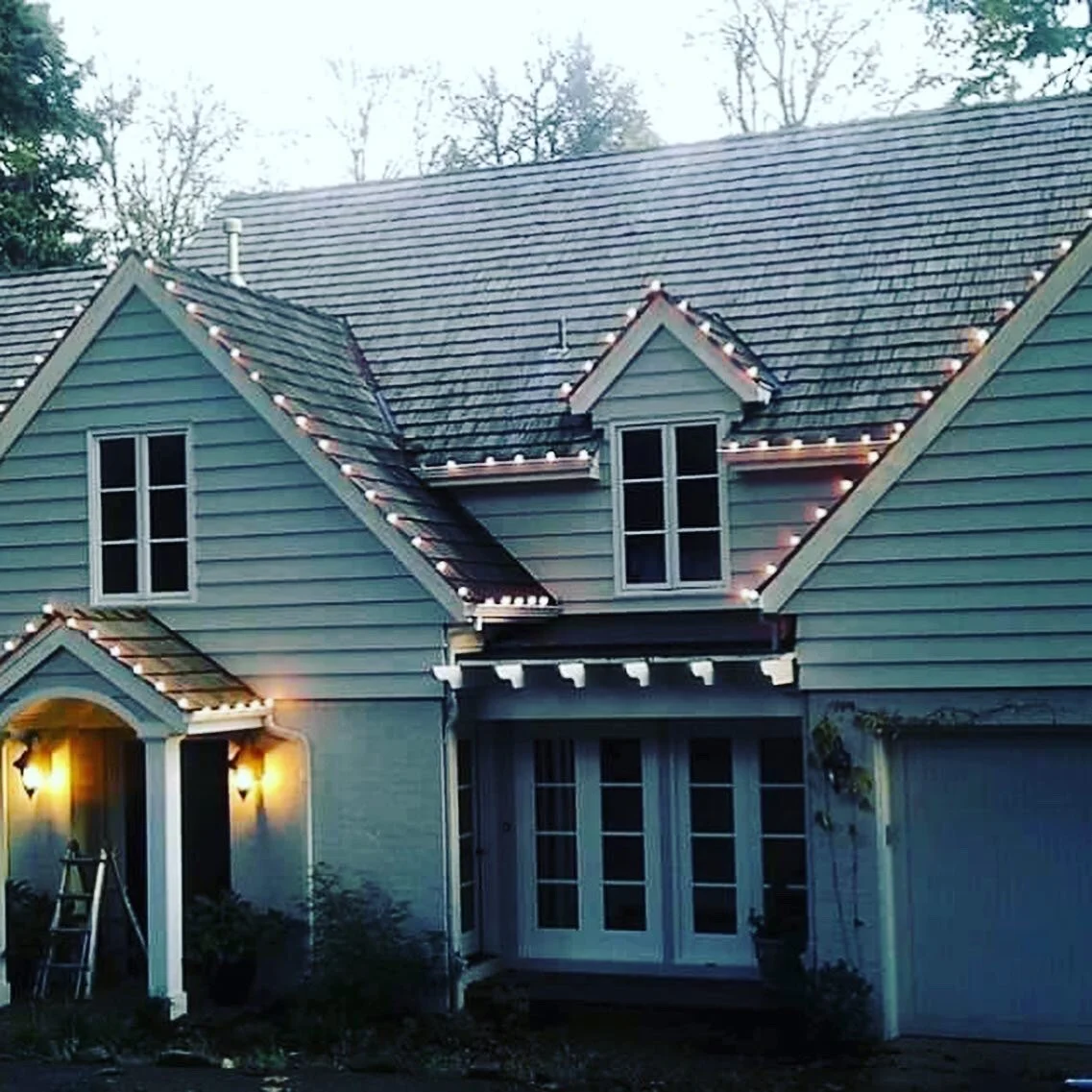 Seasonal roofline lighting installation project.