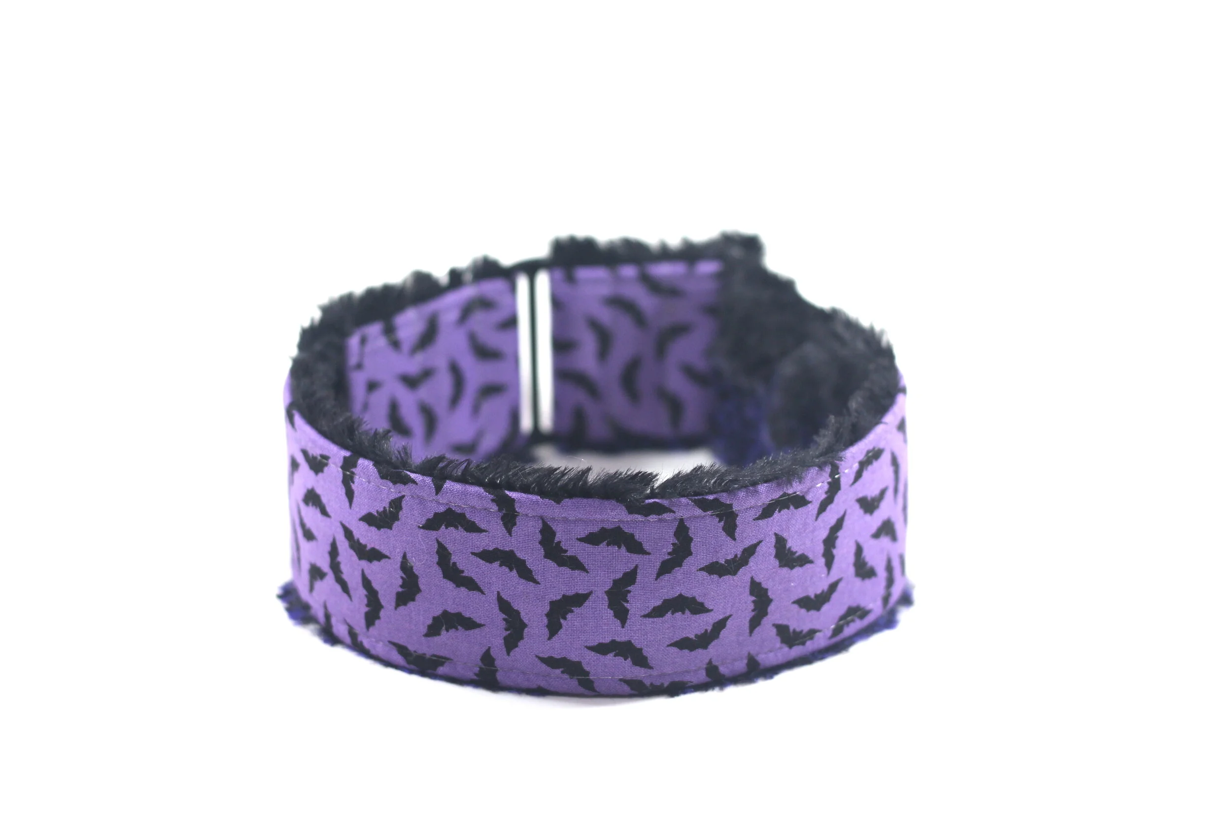 Scattered Black Bats on Purple