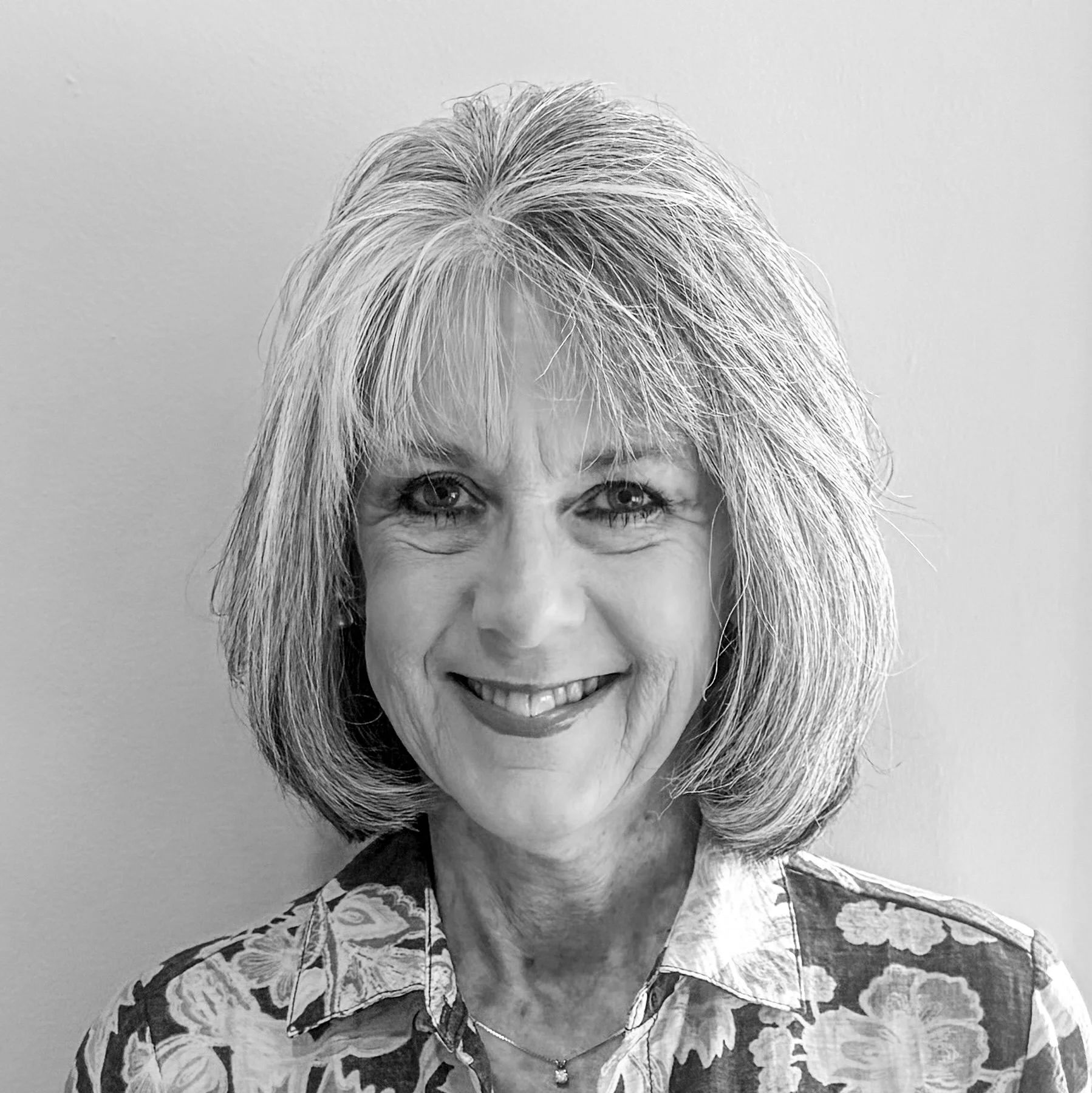 Black and white professional headshot of Shari Reinhard