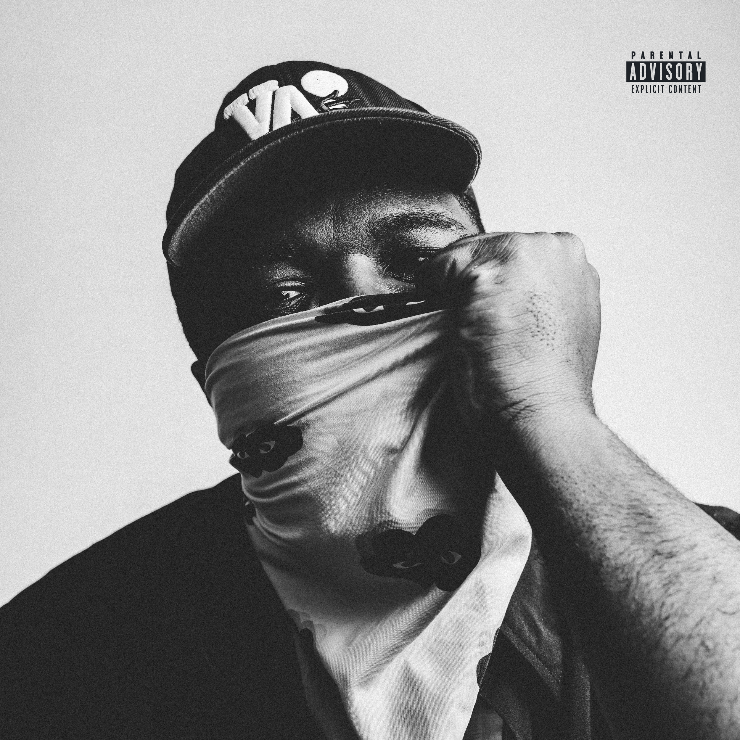 Black and white close-up of a person's face partially covered by a piece of cloth, wearing a cap with an emblem, with a 'Parental Advisory' label in the top right corner.