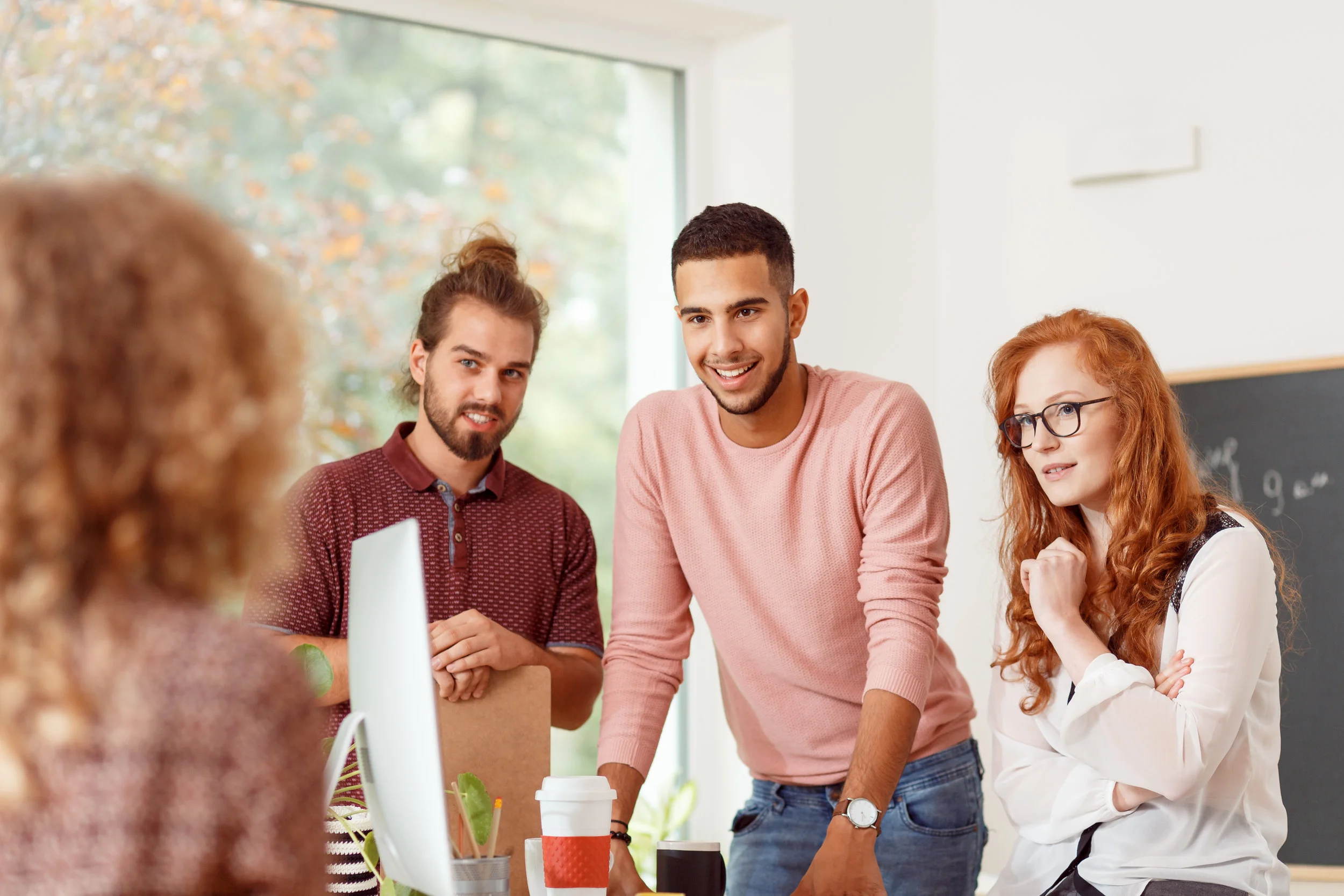 people-discussing-with-team-leader-PZV5TBN.jpg