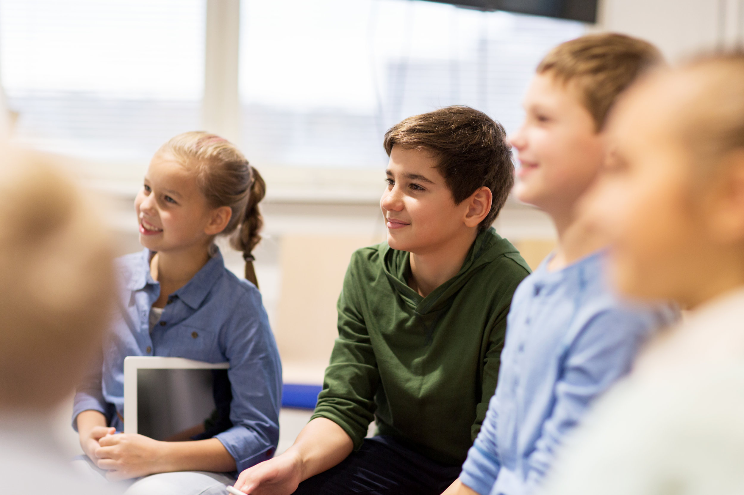 group-of-happy-kids-or-friends-learning-at-school-P5PUE9Y.jpg