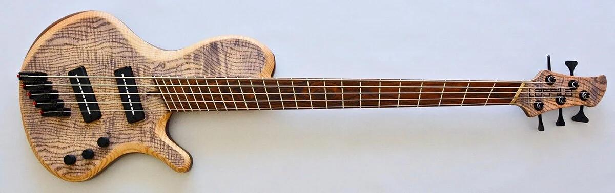 Lassila-Guitars-Antipode-Single-Cut-Fan-Fret-Bass.jpg