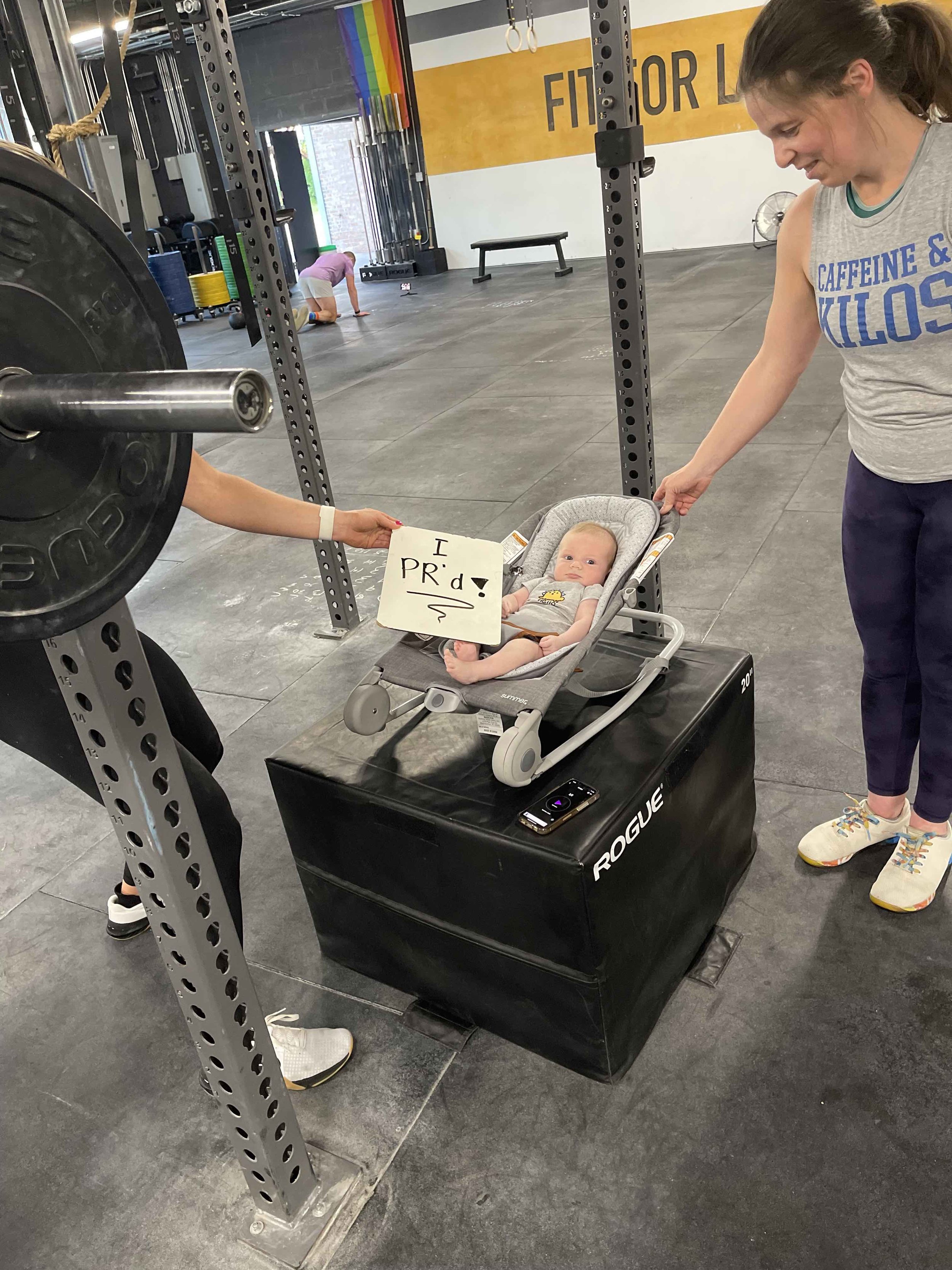 CrossFit baby with PR board.jpg